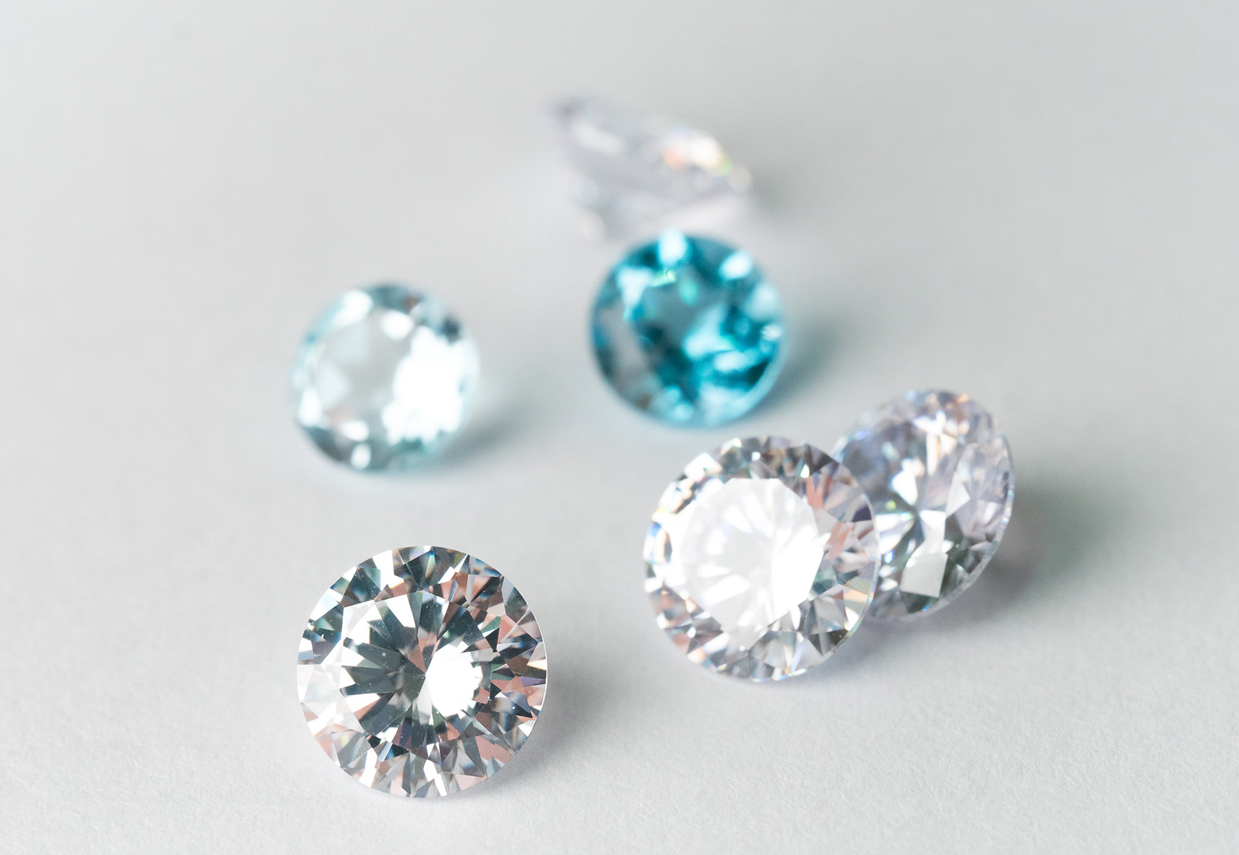 diamond jewels on light gray background