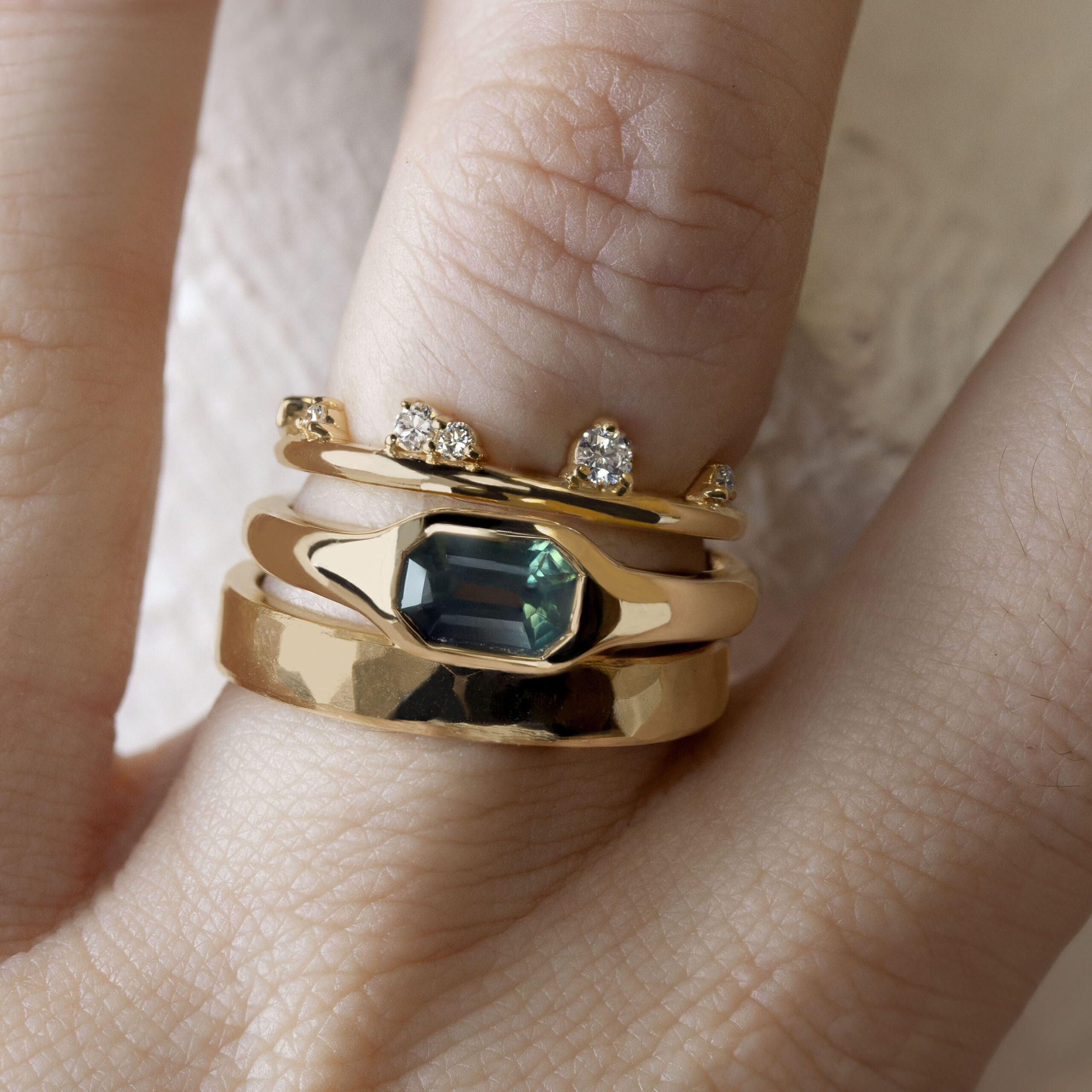 Gold signet ring by Philadelphia local jeweler Emily Chelsea Jewelry, featuring soft curves and a flush-set center stone.