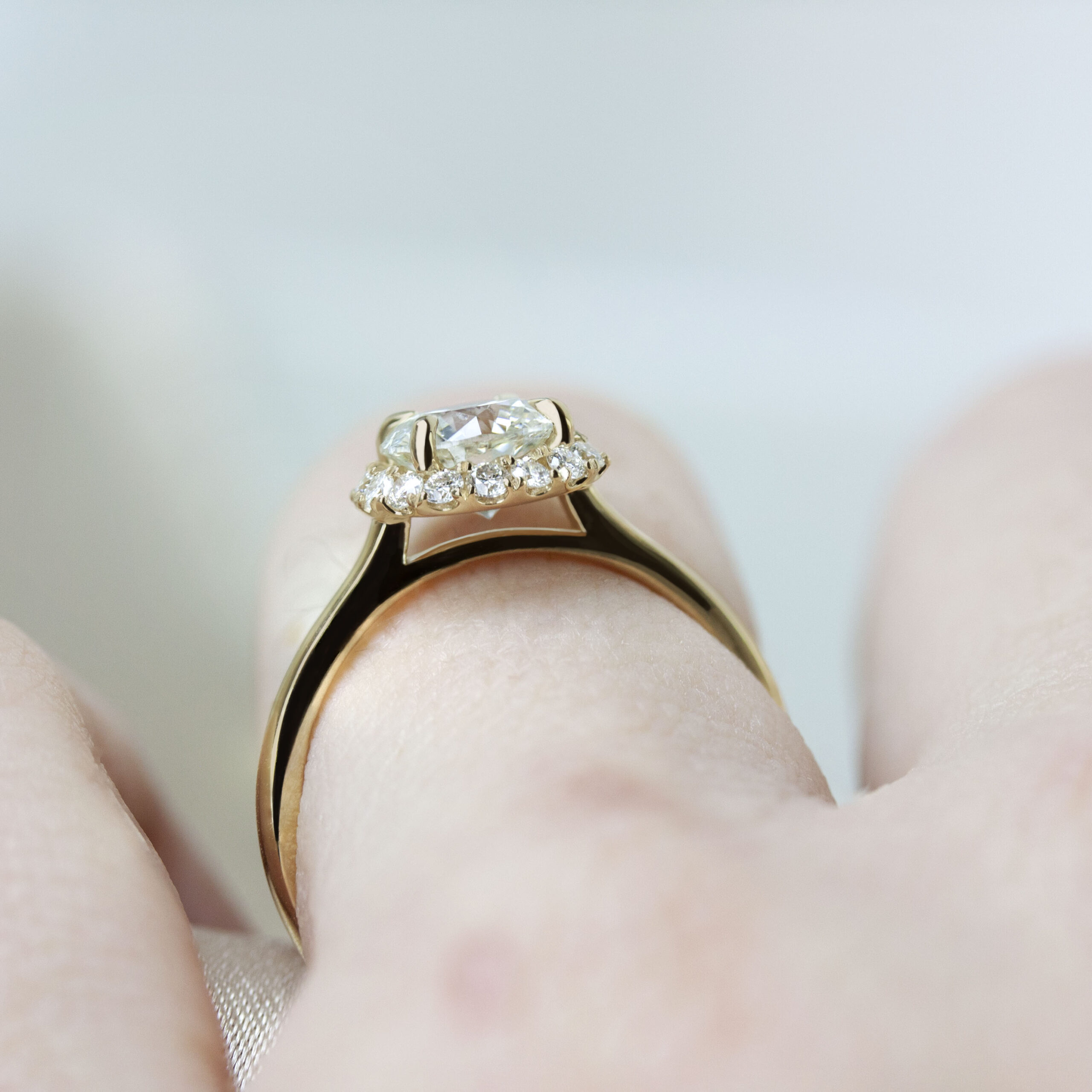 Custom Angled Halo Ring by Philadelphia's Emily Chelsea Jewelry with a diamond halo, reclaimed diamonds, and a 1.8mm band.
