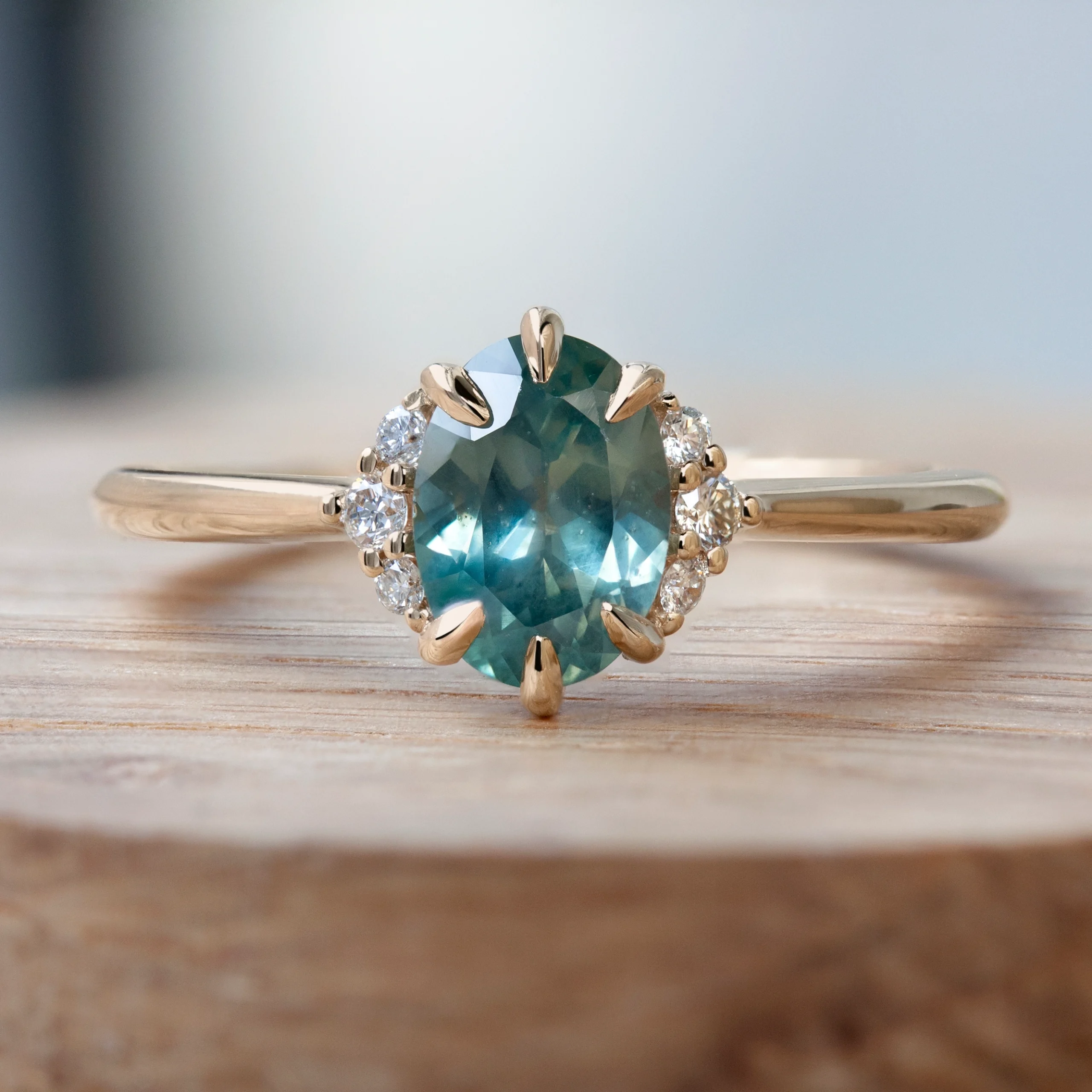 Sapphire Cloud Ring by Philadelphia's Emily Chelsea Jewelry, featuring a sapphire center stone, reclaimed diamonds, and a 1.8mm band.