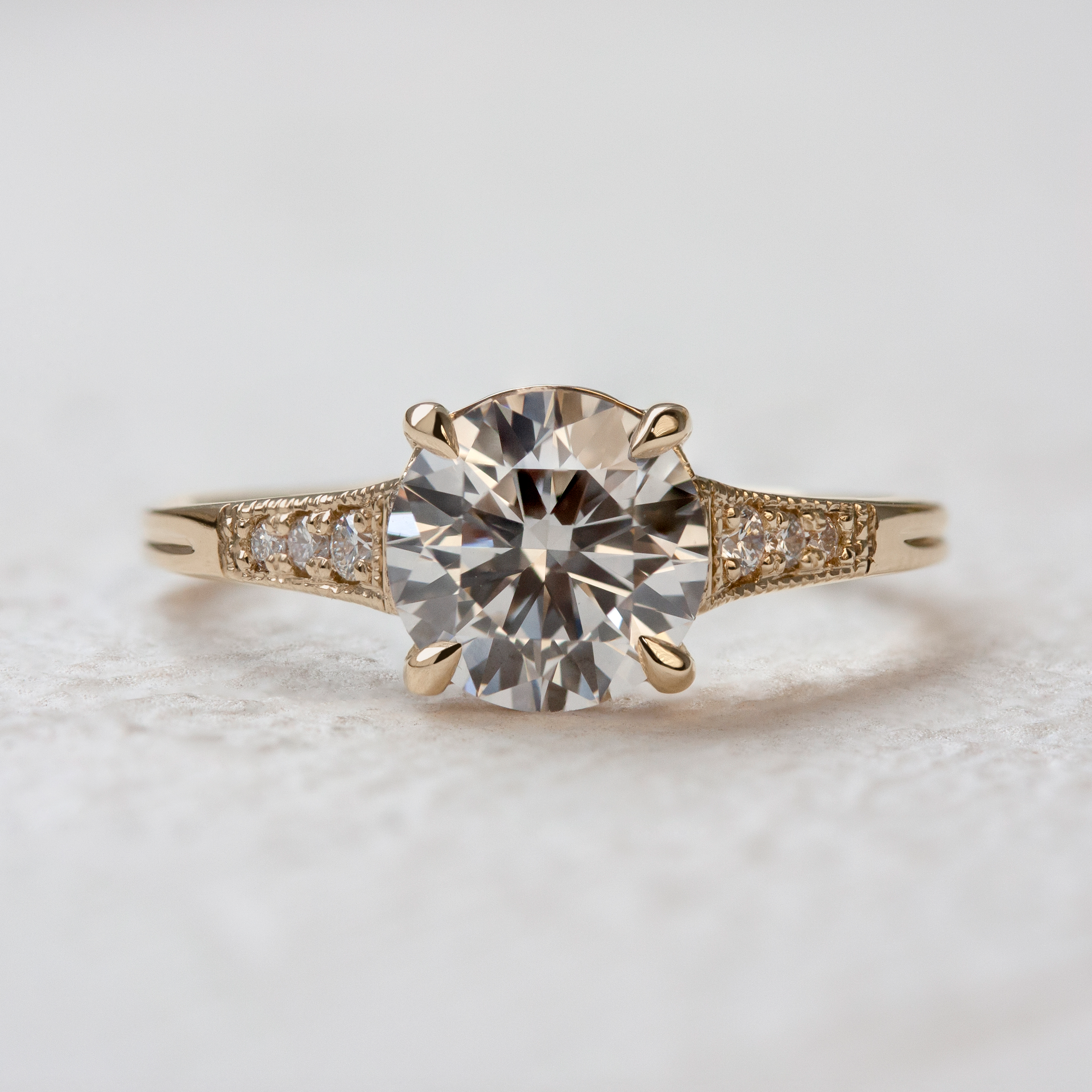 Artemis Ring by Emily Chelsea Jewelry, featuring antique milgrain detail, reclaimed diamonds, and a unique crossed-metal undergallery.