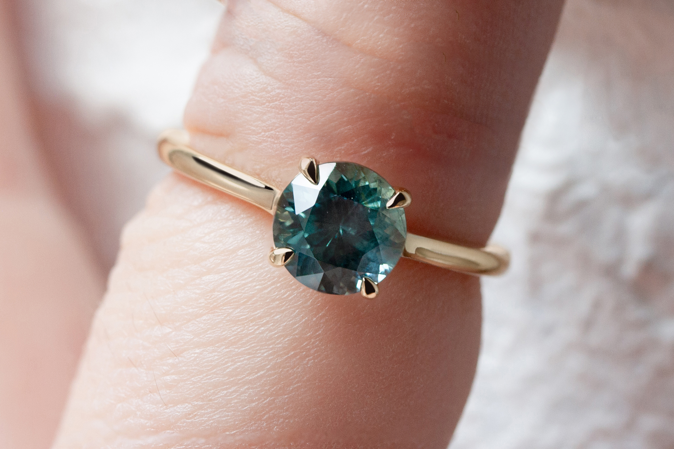 Timeless solitaire ring by Philadelphia's Emily Chelsea Jewelry, with a hidden halo, subtle sparkle, and reclaimed diamonds on a 2mm band.