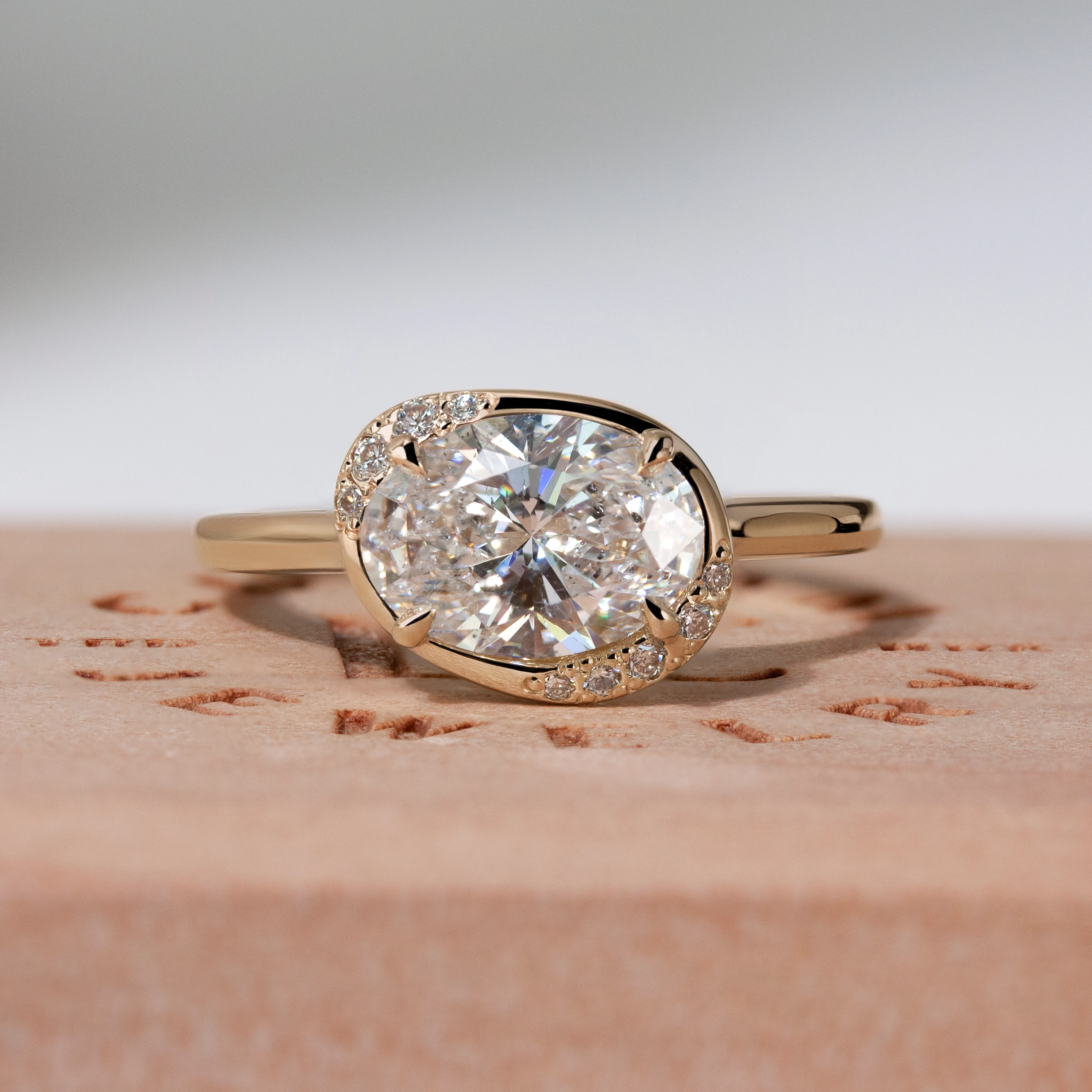 Aura Ring by Philadelphia's Emily Chelsea Jewelry, featuring a unique asymmetrical halo, reclaimed diamonds, and a 1.8mm band.