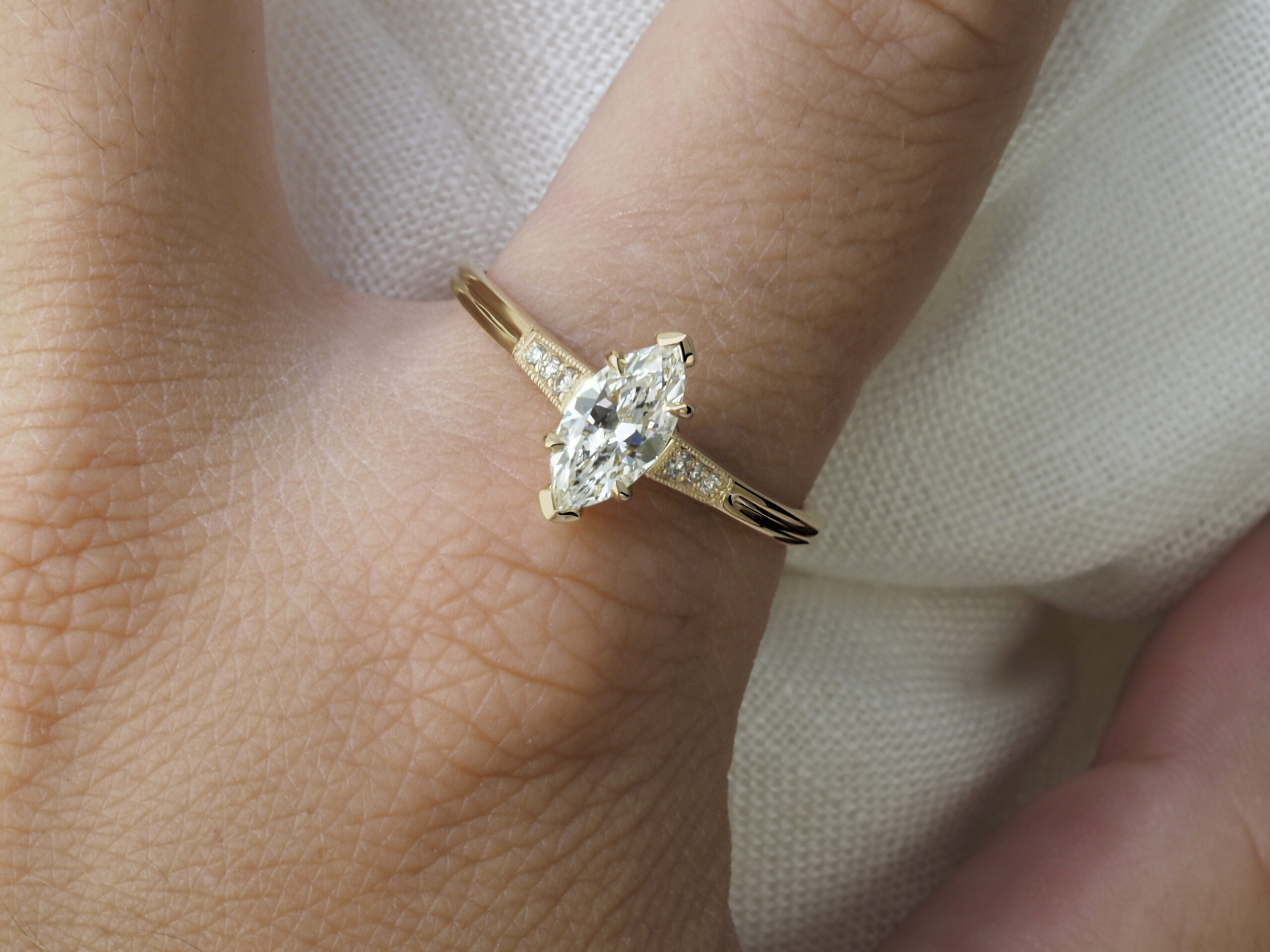 Artemis Ring by Philadelphia local jeweler Emily Chelsea Jewelry with antique milgrain detail, reclaimed diamonds, and a crossed-metal undergallery.