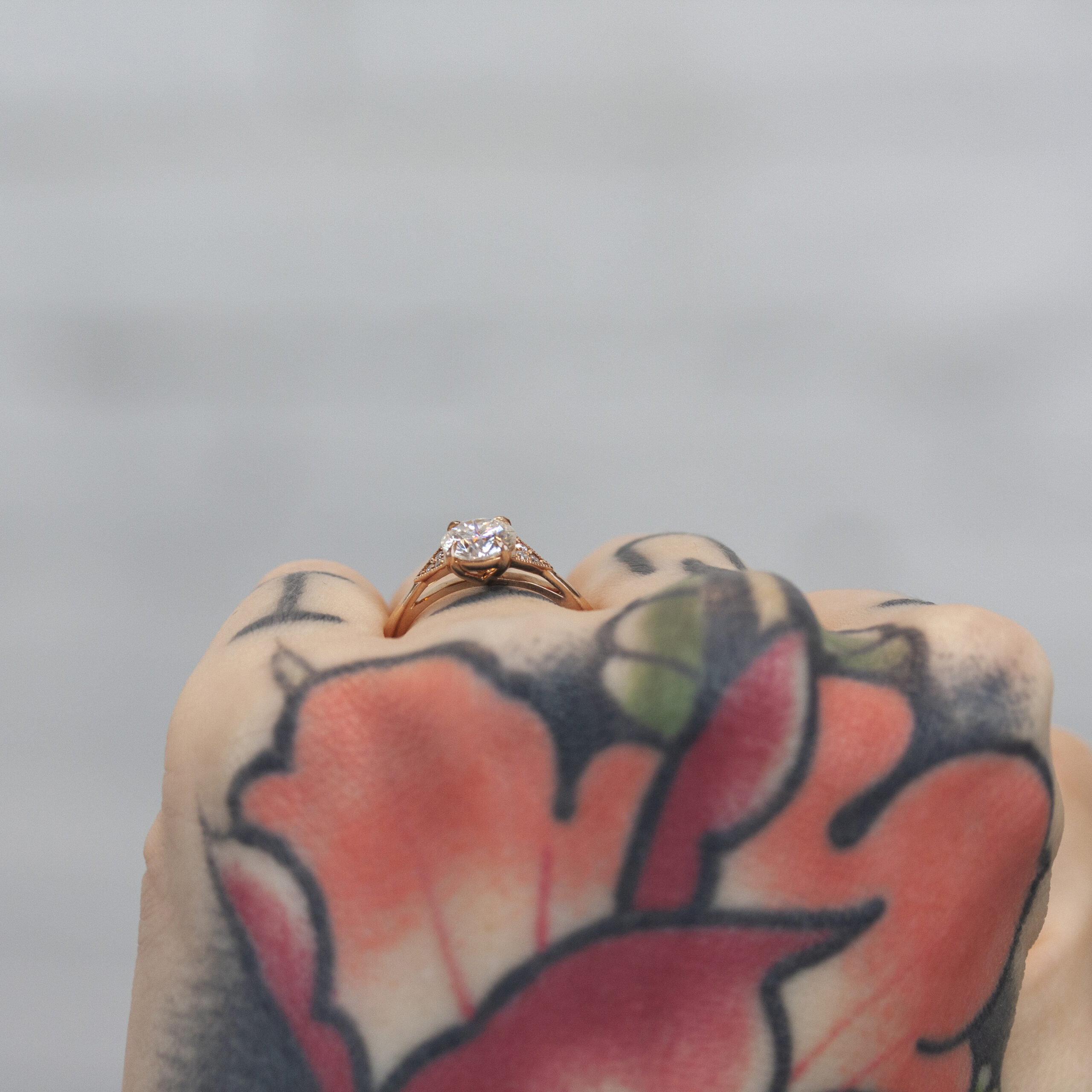 Custom June Ring by Philadelphia's Emily Chelsea Jewelry, showcasing a geometric design, reclaimed white diamonds, and a timeless white center stone.