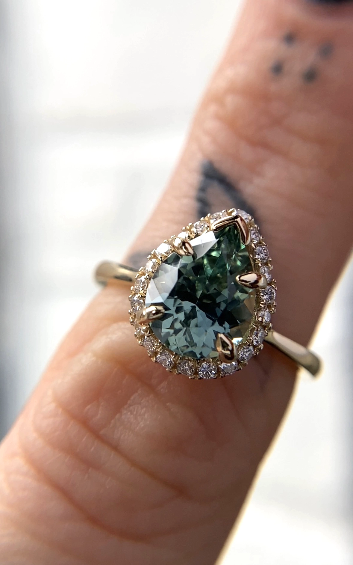 Angled Halo Ring by Philadelphia's Emily Chelsea Jewelry with a downward-angled diamond halo, reclaimed diamonds, and a 1.8mm band.