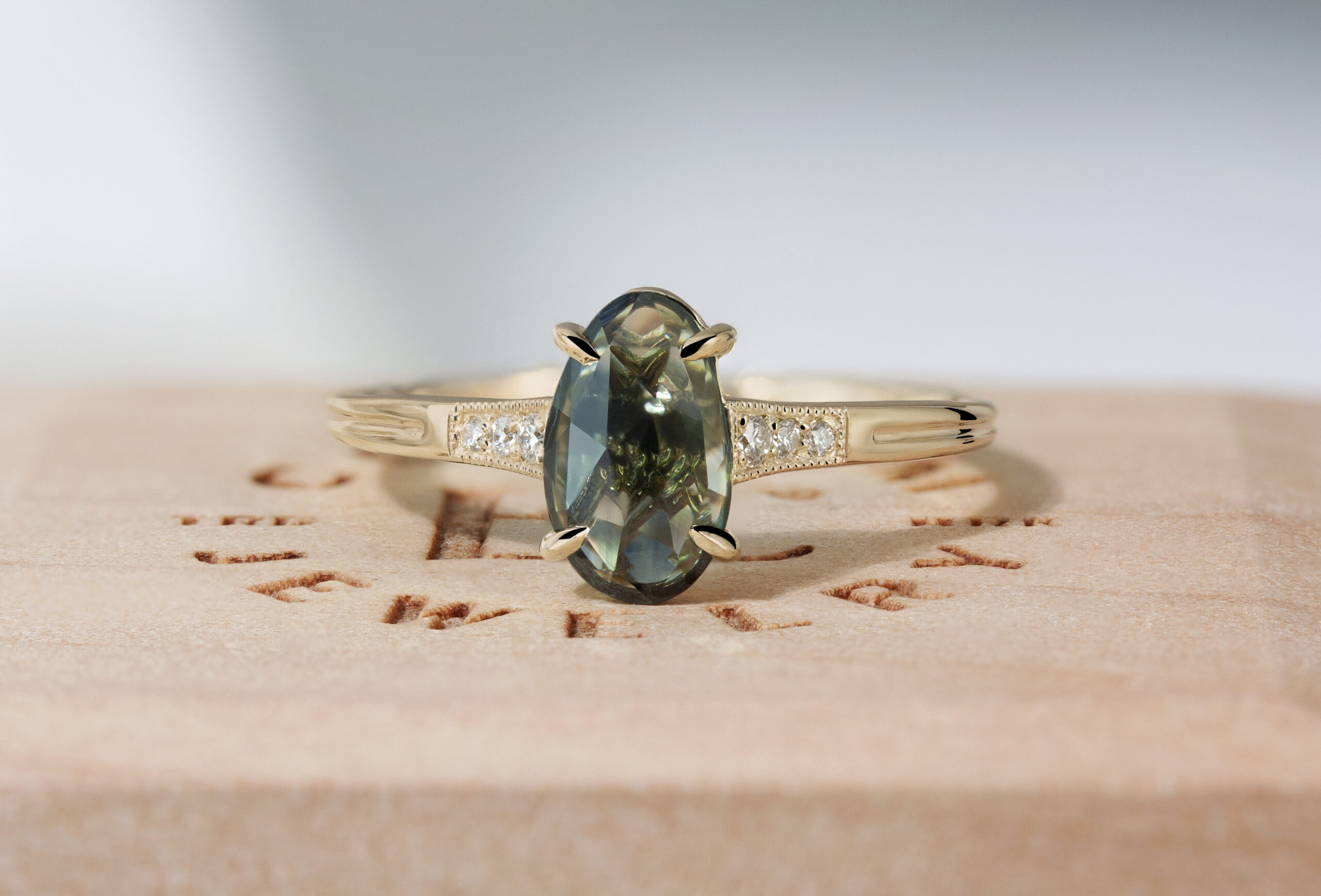 Artemis Ring by Philadelphia's Emily Chelsea Jewelry with antique milgrain detail, delicate sparkle, and a crossed-metal undergallery.