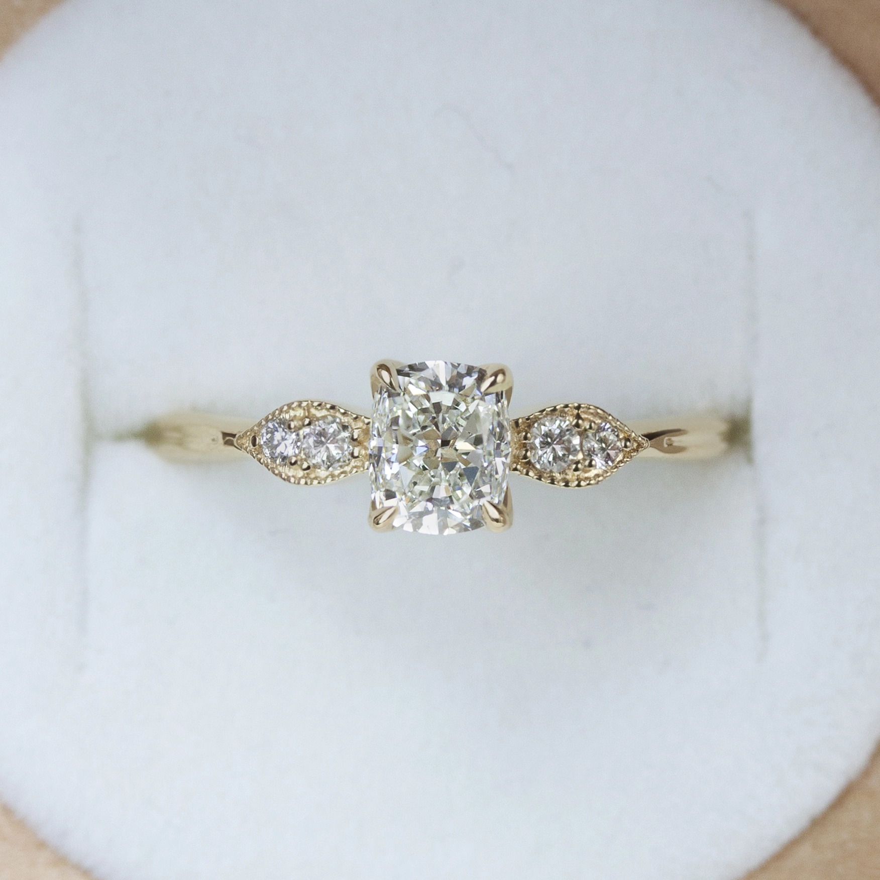 Custom-designed Gardenia Ring by Philadelphia's Emily Chelsea Jewelry, featuring floral details, milgrain texture, and 0.08ctw reclaimed diamonds.