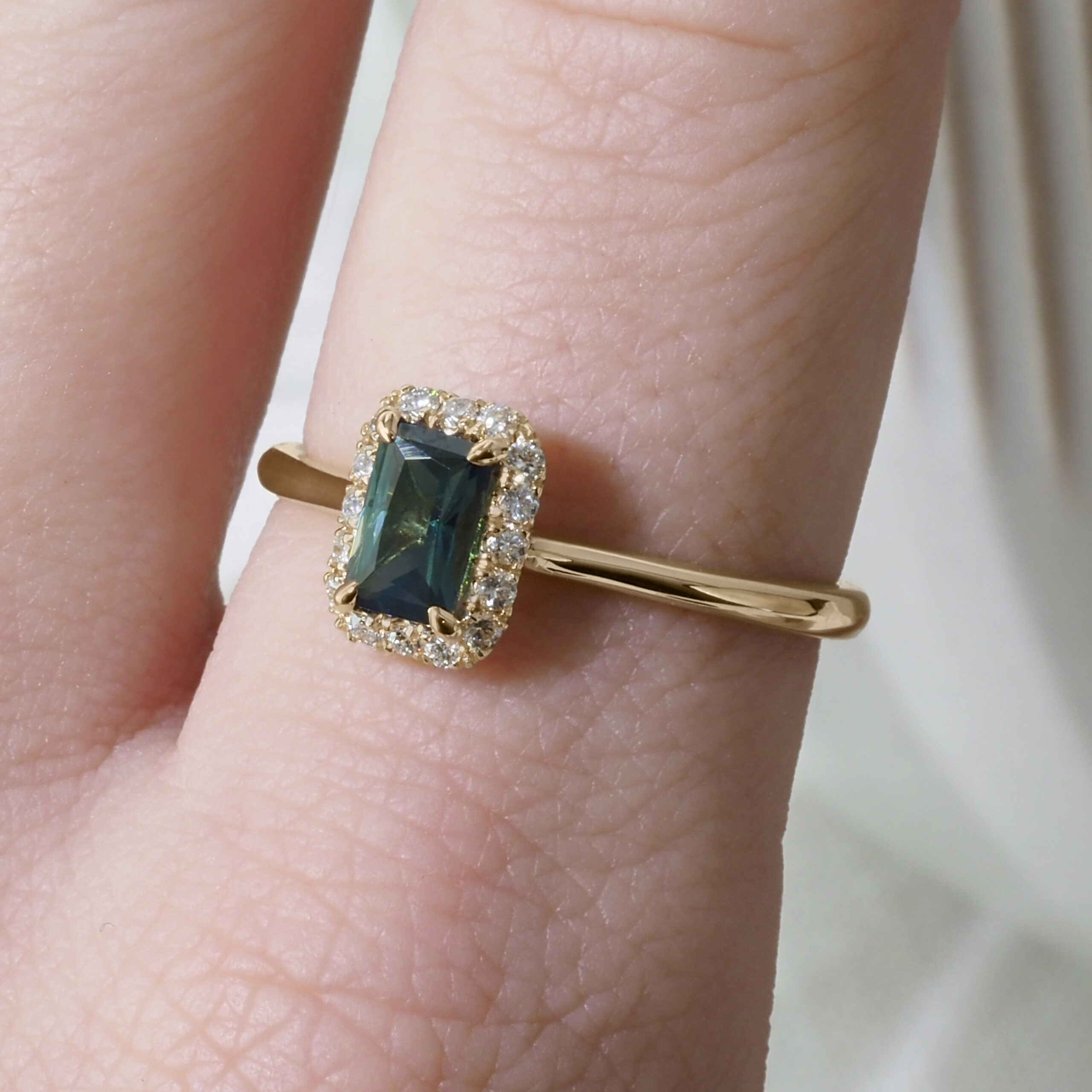 Angled Halo Ring by Philadelphia's Emily Chelsea Jewelry with a diamond halo, reclaimed diamonds, and a 1.8mm band.