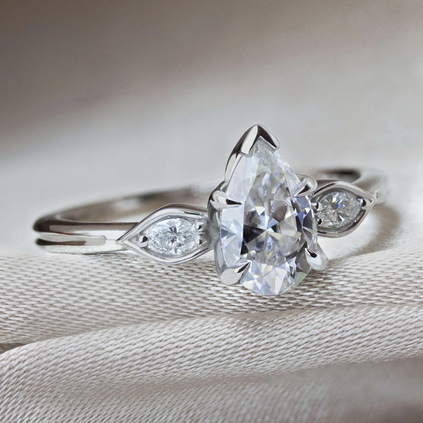 The Gardenia Ring by Philadelphia local jeweler Emily Chelsea Jewelry, a custom engagement ring with floral details, milgrain texture, and 0.08ctw reclaimed diamonds.