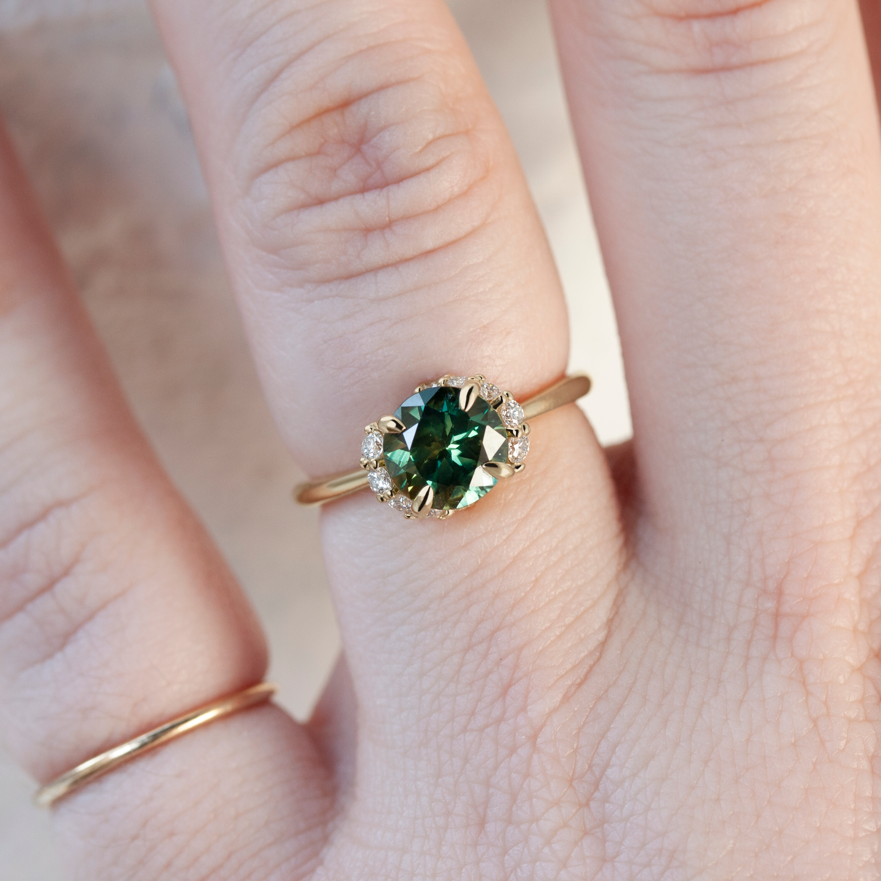 Spiral Staircase Ring by Philadelphia local jeweler Emily Chelsea Jewelry, with a crescendo of reclaimed diamonds, a bold center stone, and a 2mm band.