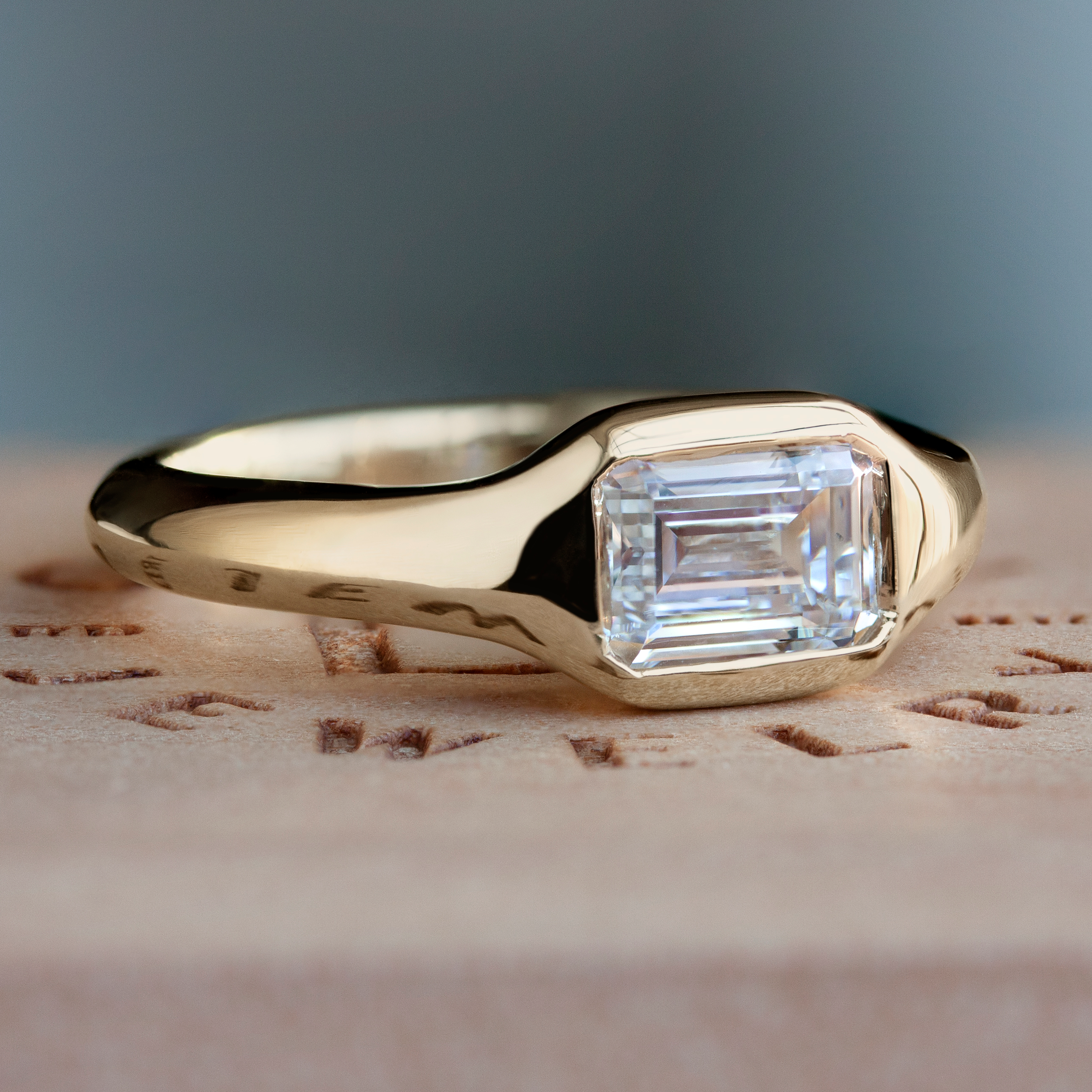 Classic gold square signet ring by Philadelphia's Emily Chelsea Jewelry with soft curves and a flush-set diamond.
