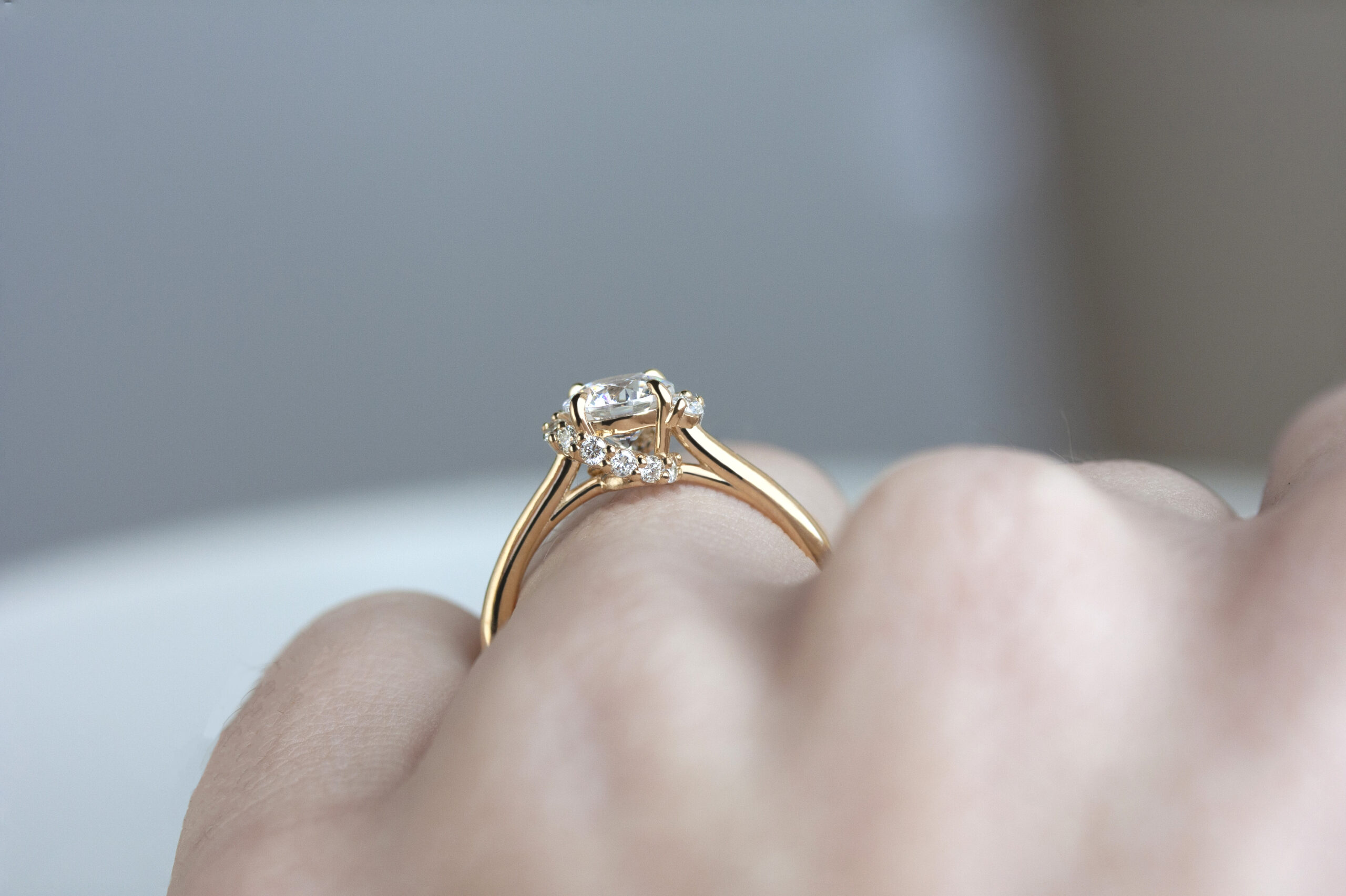 Spiral Staircase Ring by Philadelphia's Emily Chelsea Jewelry, featuring a crescendo of reclaimed diamonds swirling around a center stone with a 2mm band.