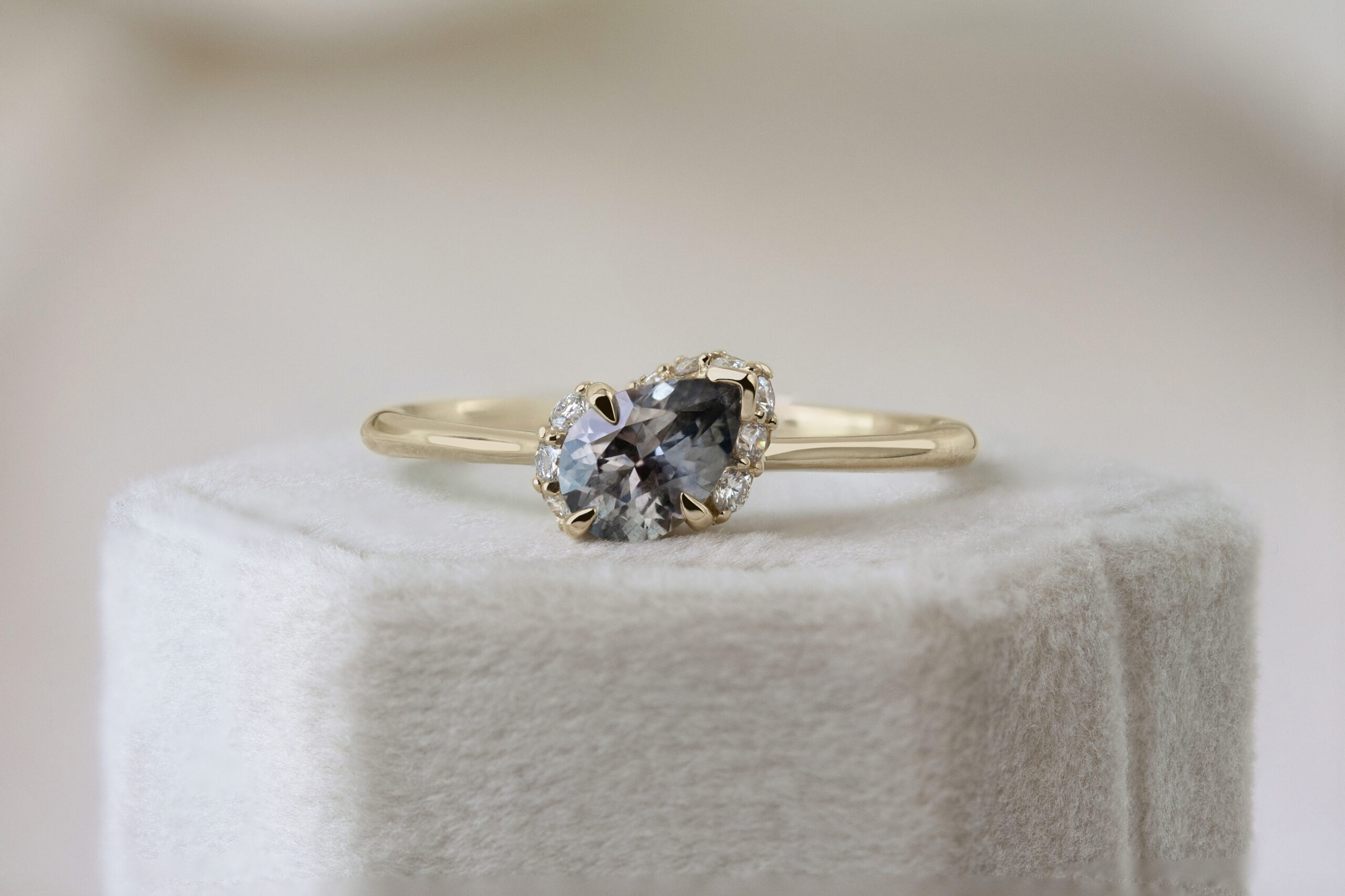 Spiral Staircase Ring by Philadelphia's Emily Chelsea Jewelry, featuring swirling reclaimed diamonds, a striking center stone, and a 2mm band.
