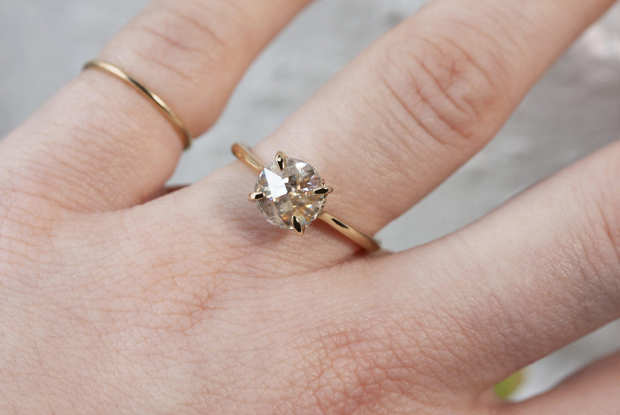Timeless solitaire ring by Philadelphia local jeweler Emily Chelsea Jewelry, featuring a hidden halo, reclaimed diamonds, and a 2mm band.