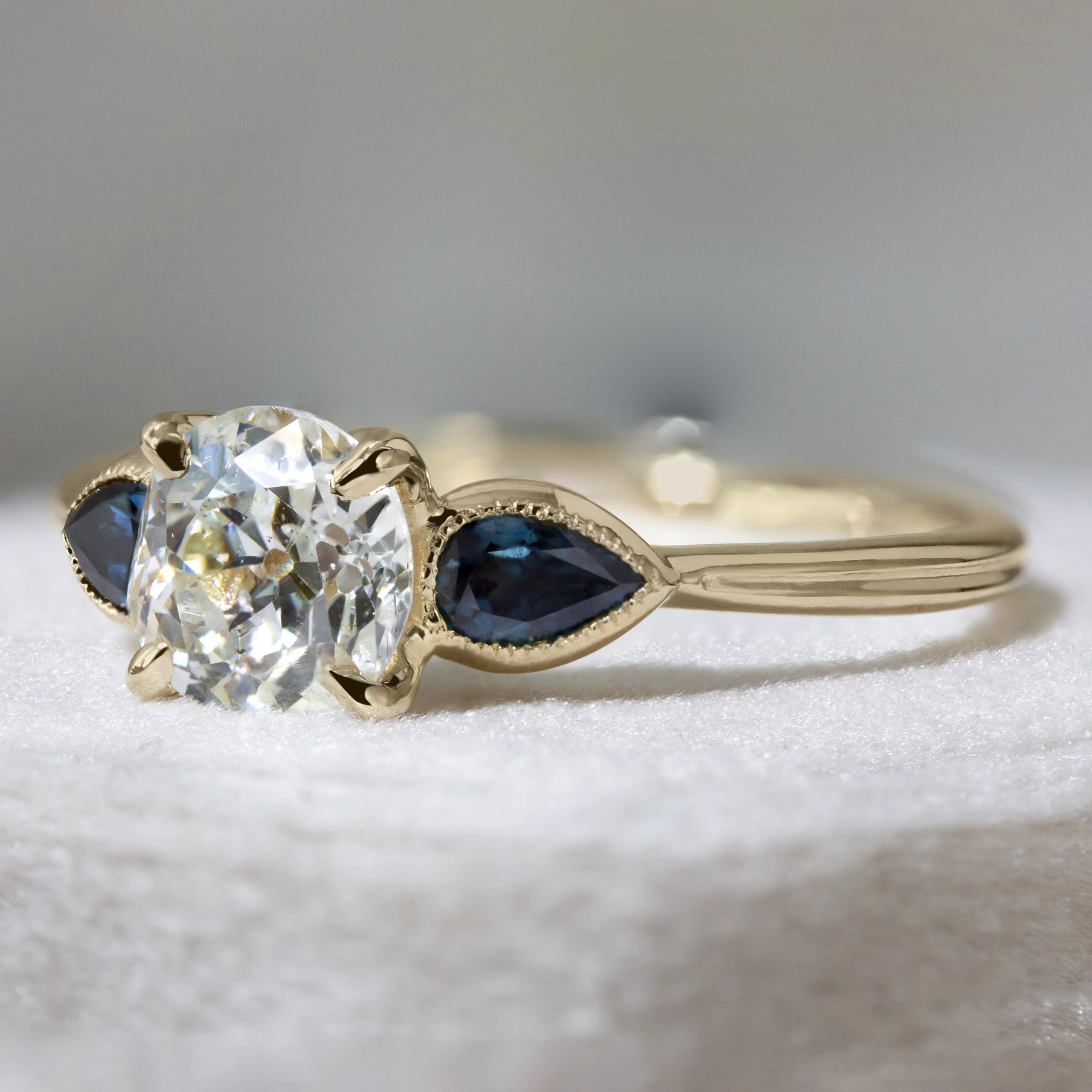 The Gardenia Ring by Philadelphia local jeweler Emily Chelsea Jewelry, a custom-designed diamond ring with floral details, petal prongs, and milgrain texture.
