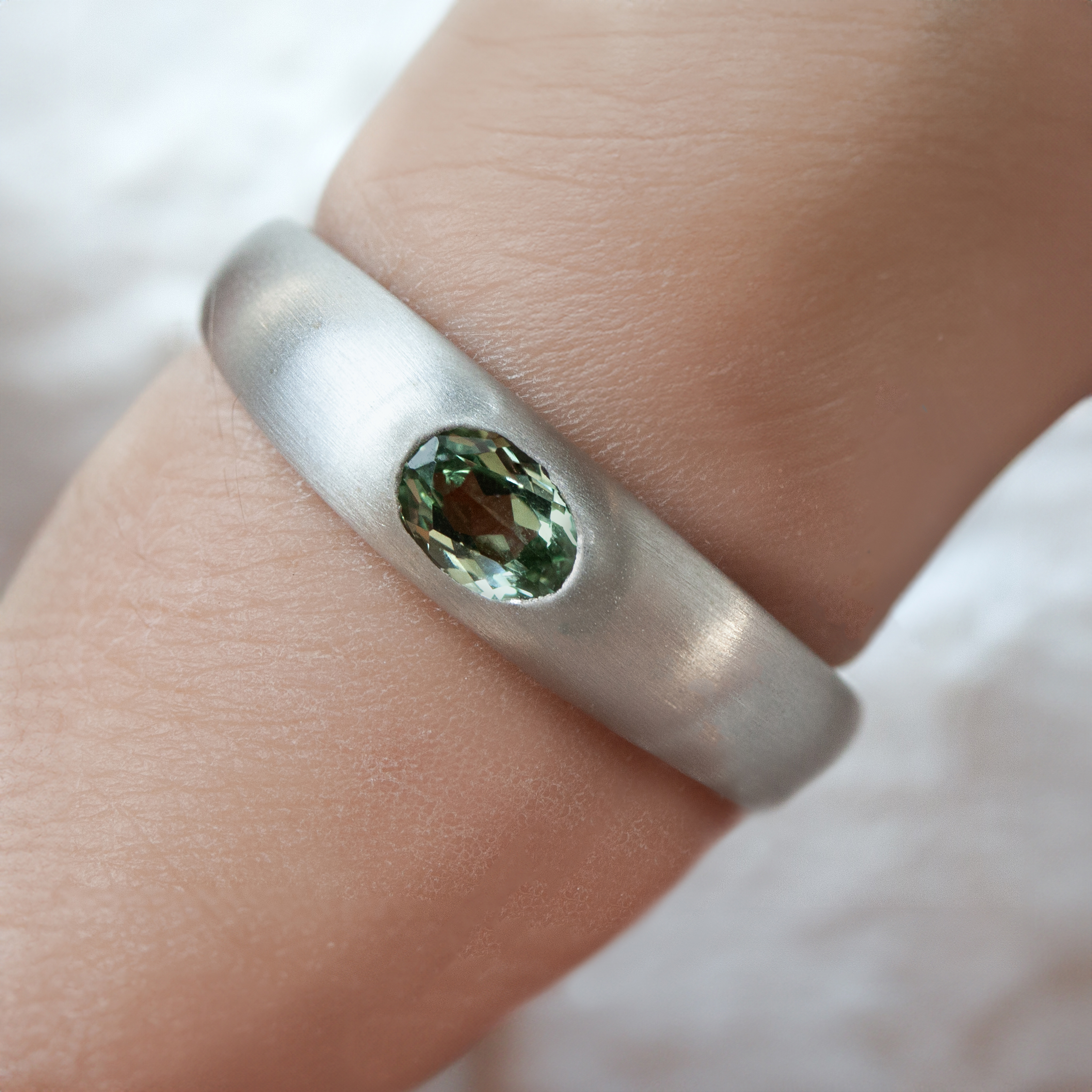 Hague Ring by Philadelphia's Emily Chelsea Jewelry with a low-profile, burnished center stone, and 3.5mm band in brushed or polished finish.