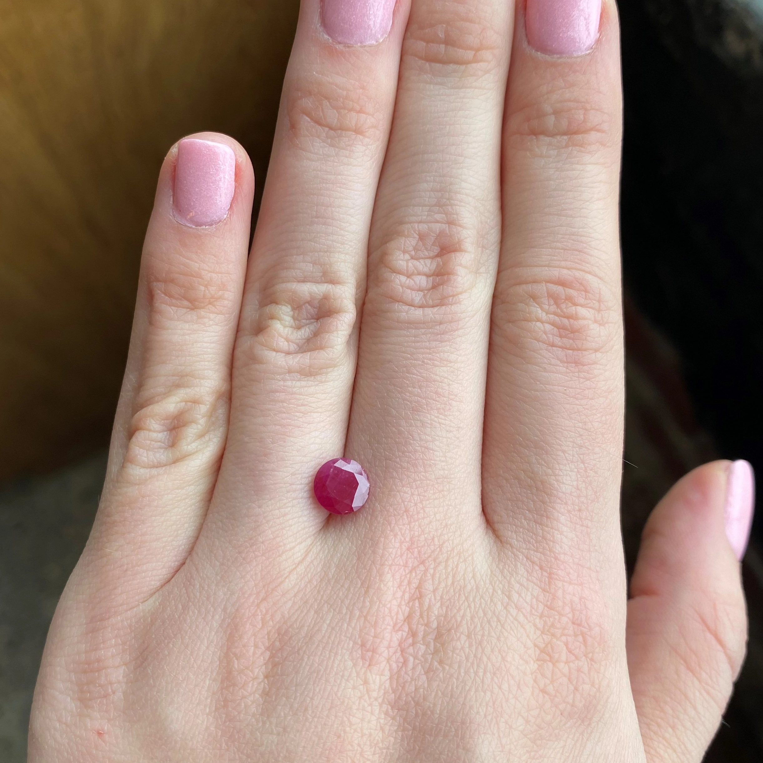 1.74ct round red ruby from Liberia, 7mm diameter, unknown treatment. Emily Chelsea Custom Jeweler in Philadelphia.