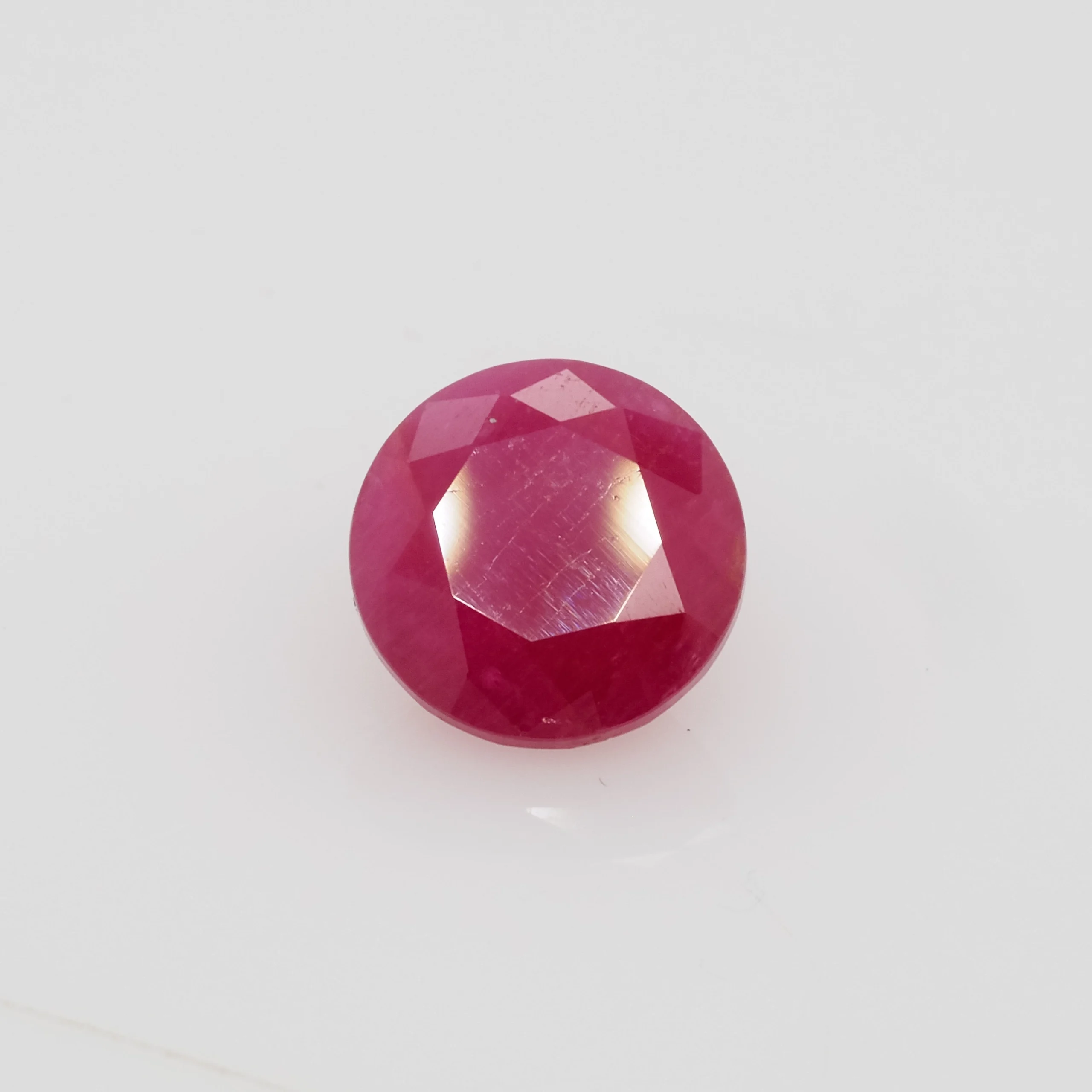 1.74ct round red ruby from Liberia, 7mm diameter, unknown treatment. Emily Chelsea Custom Jeweler in Philadelphia.
