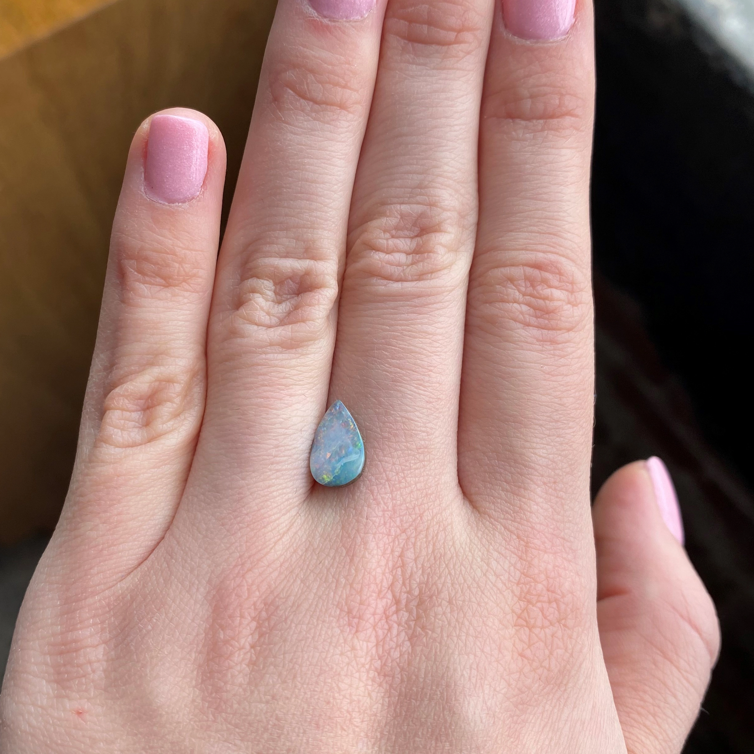 1.53ct pear-cut Australian boulder opal, 11.27mm x 7.16mm. Unheated, 5.5-6.5 Mohs hardness. Emily Chelsea Custom Jeweler in Philadelphia.