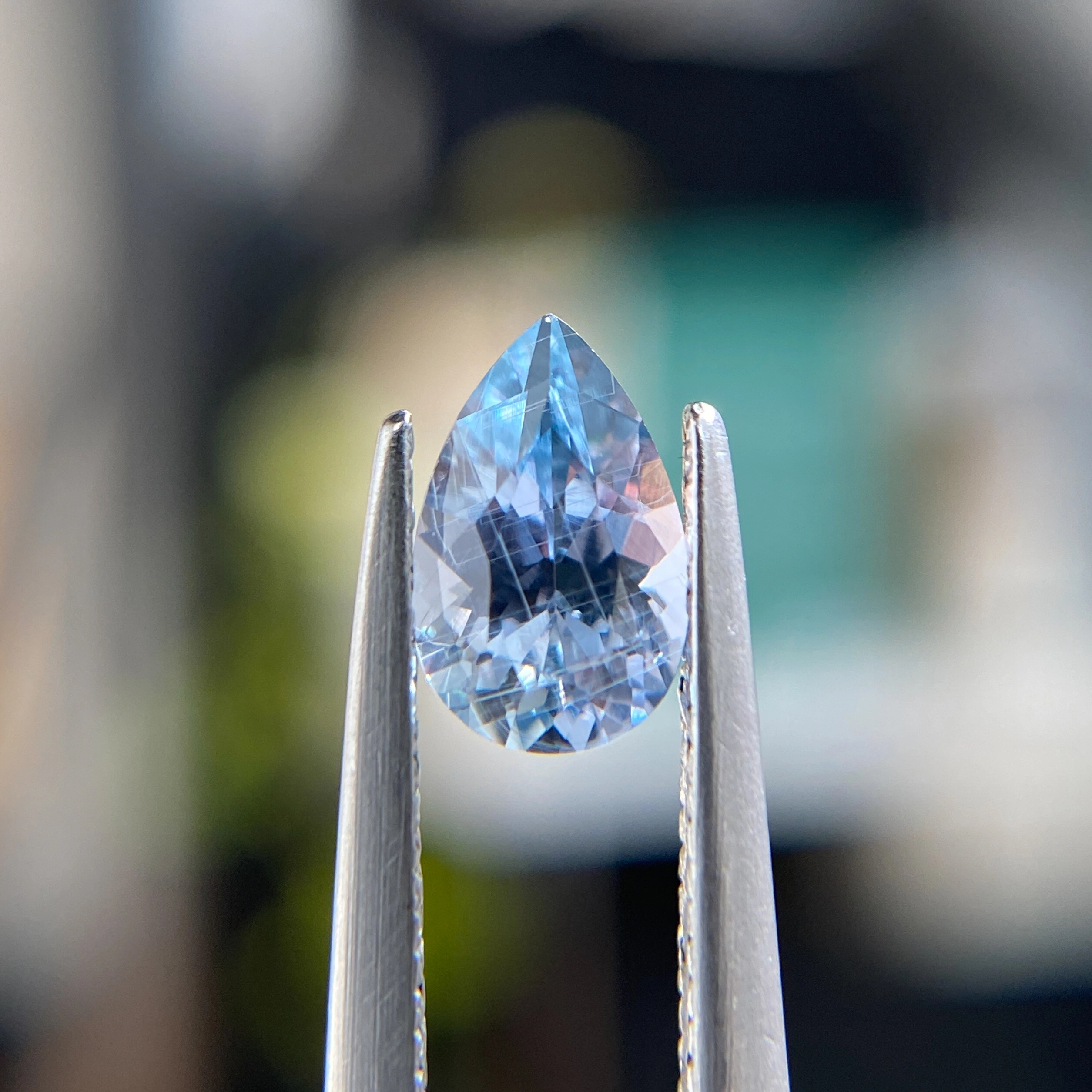 0.80ct unheated pear-cut bluish purple Montana sapphire, 7.20mm x 4.61mm. Color shifts in different lighting. Only one available. Philadelphia custom jeweler Emily Chelsea.