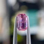 0.99ct unheated emerald-cut pink and purple Winza sapphire, 6.93mm x 4.26mm. Rare color-zoned gem. Emily Chelsea Custom Jeweler in Philadelphia.