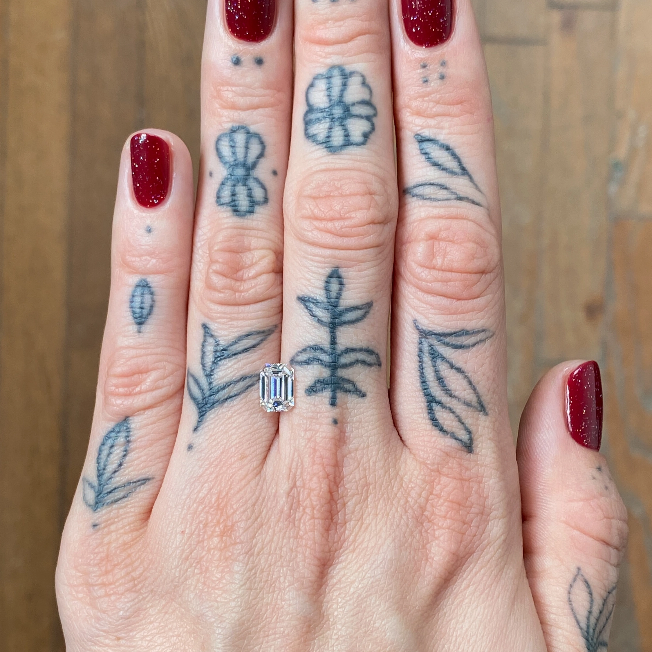 Woman's hand showing a diamond - Emily Chelsea Jewelers