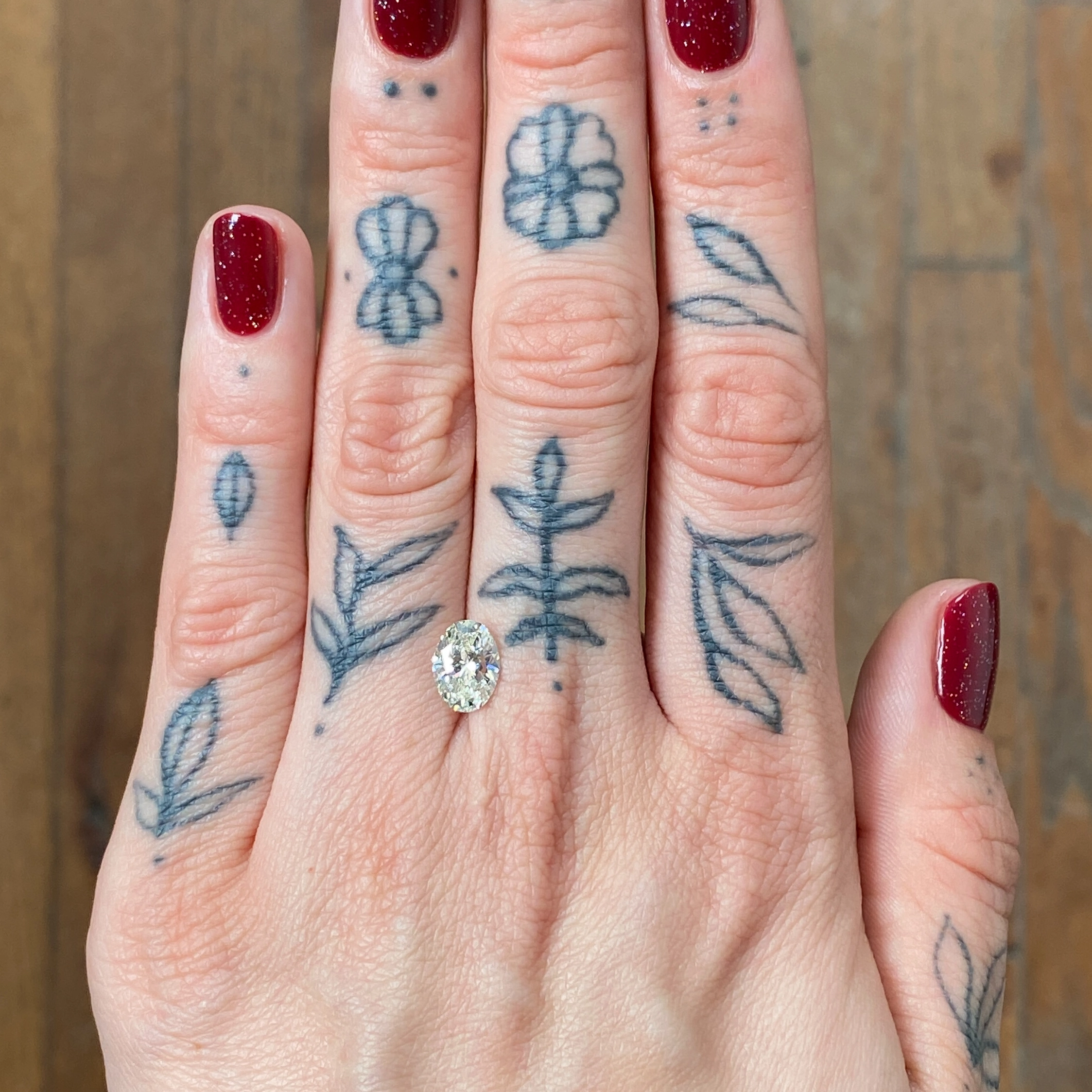 Woman's hand showing a diamond - Emily Chelsea Jewelers