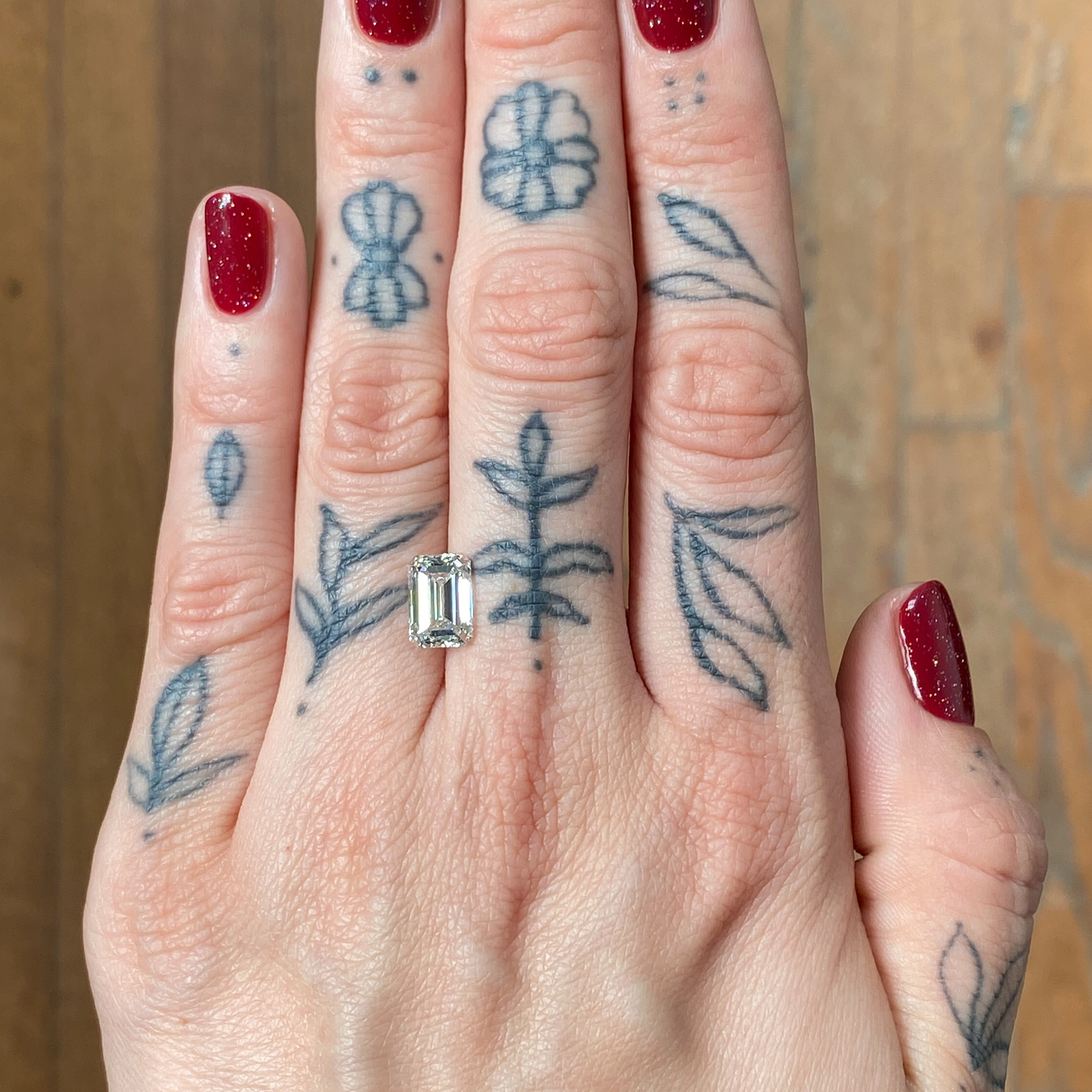 Woman's hand showing a diamond - Emily Chelsea Jewelers
