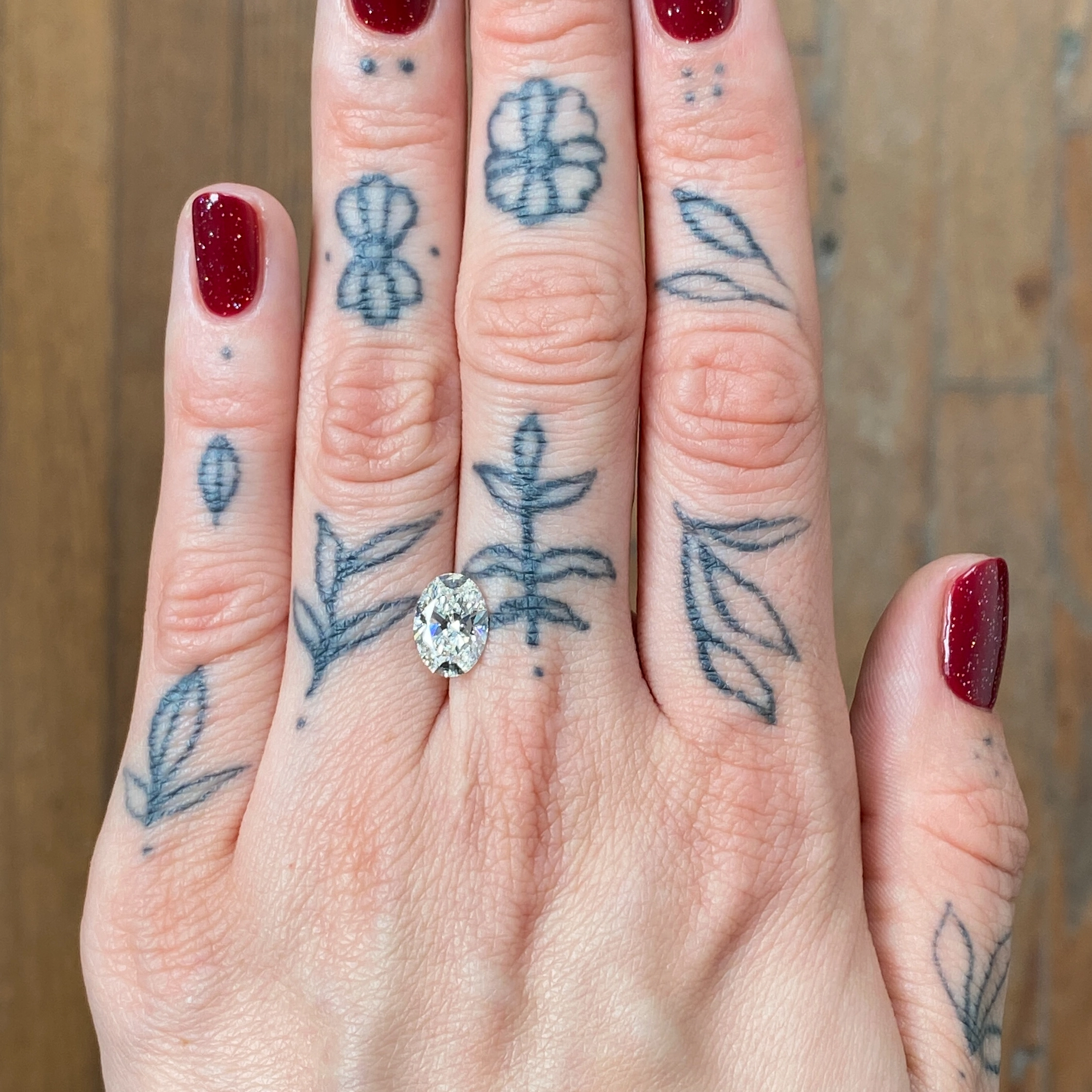 Woman's hand showing a diamond - Emily Chelsea Jewelers