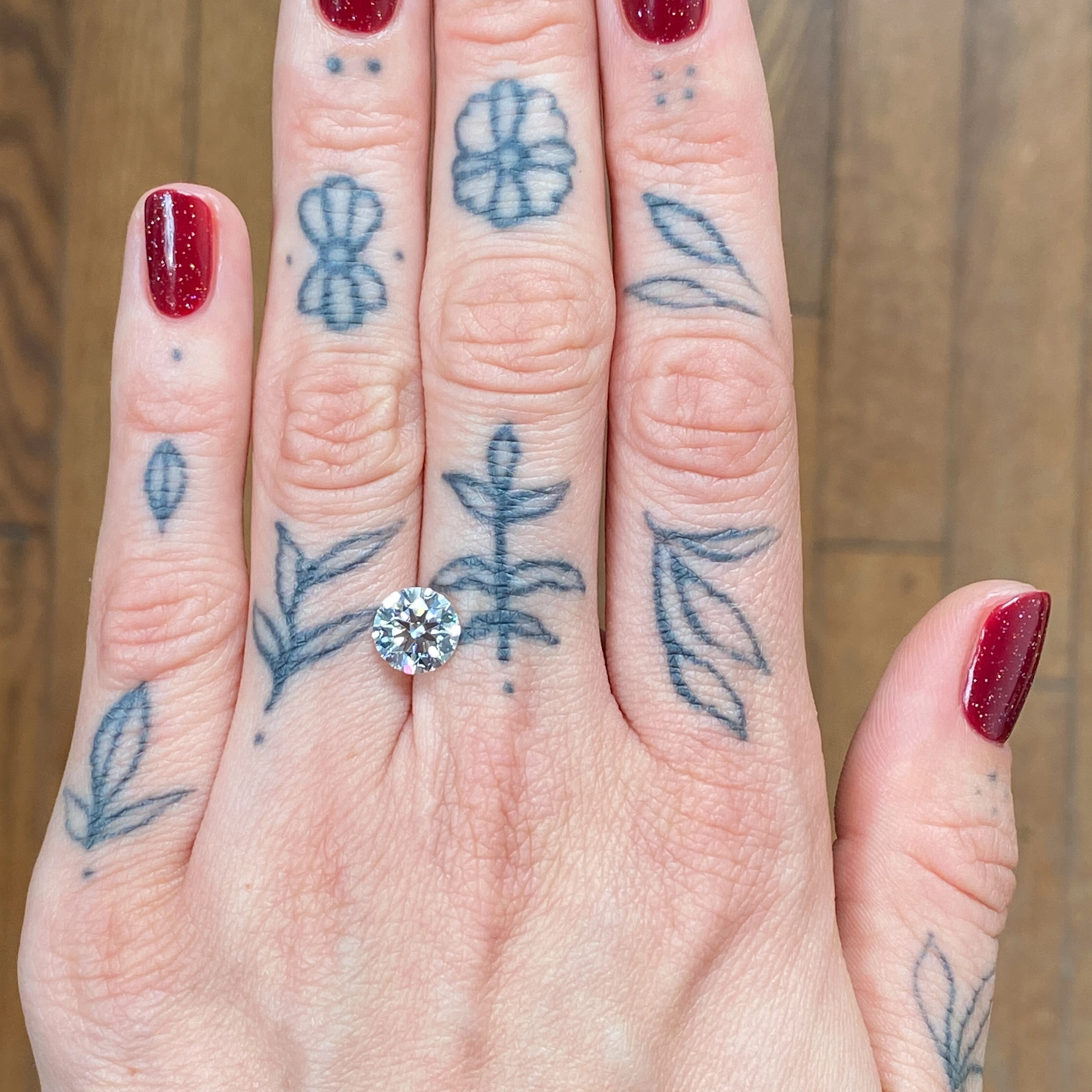 Woman's hand showing a diamond - Emily Chelsea Jewelers