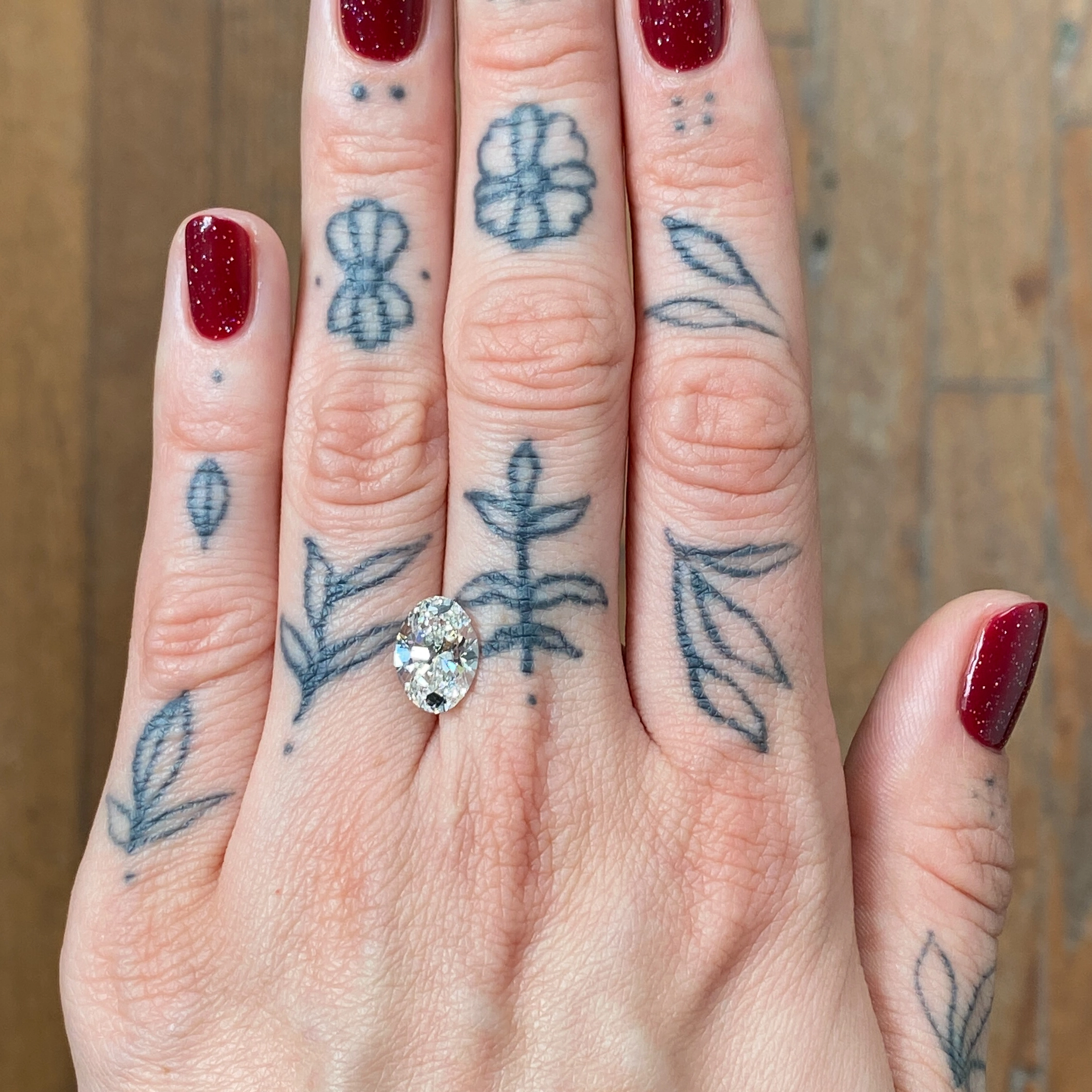Woman's hand showing a diamond - Emily Chelsea Jewelers