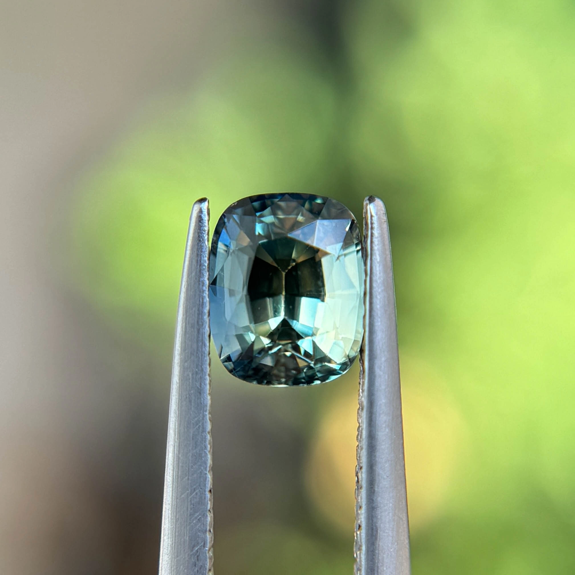 1.16ct unheated cushion-cut teal sapphire from Nigeria, available at Philadelphia’s Emily Chelsea Jewelry.