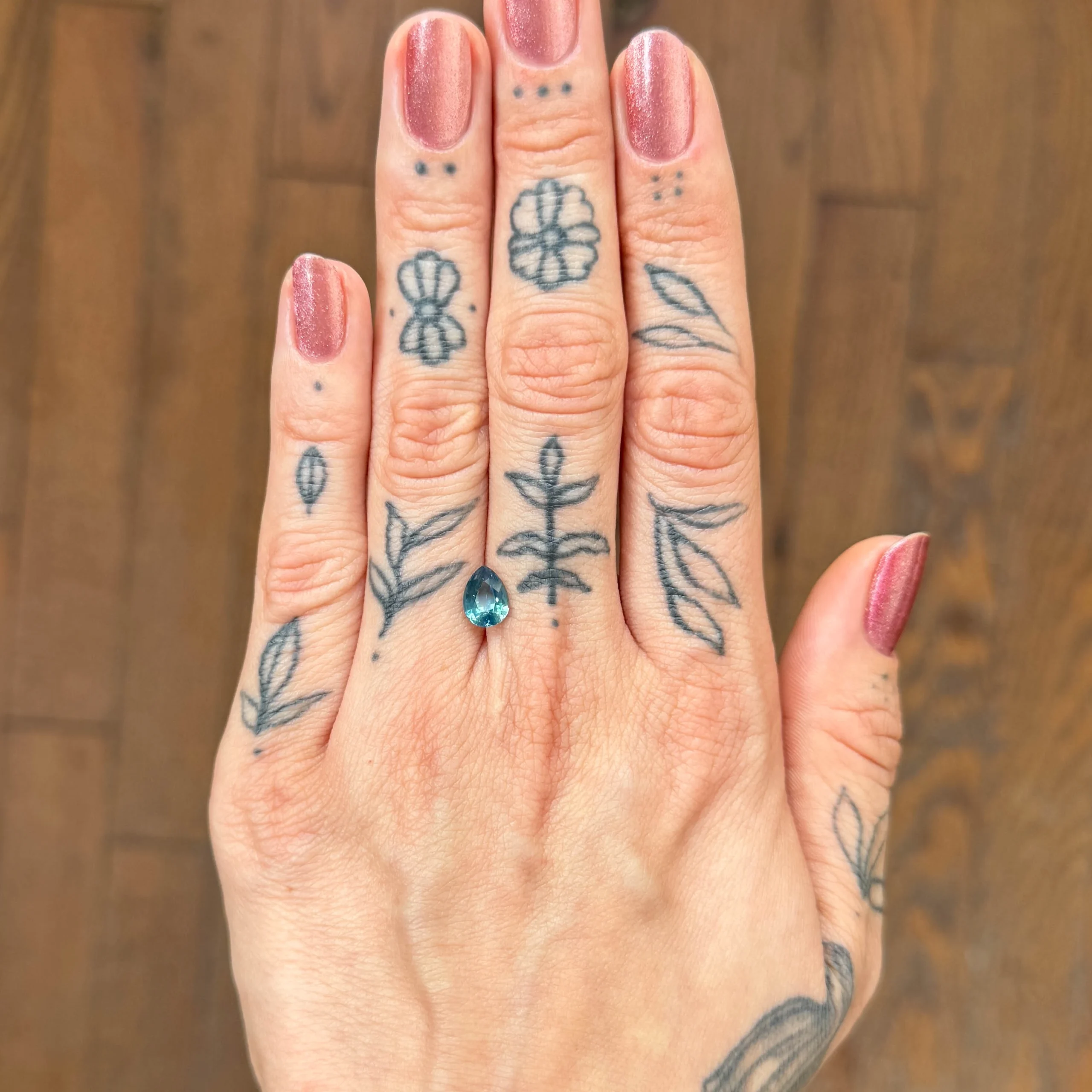 1.67ct unheated pear-cut teal sapphire from Nigeria, available at Philadelphia’s Emily Chelsea Jewelry.