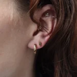 Bar-set stud earrings by Philadelphia’s Emily Chelsea Jewelry, featuring Australian baguette bicolor sapphires with a blue-to-yellow gradient.