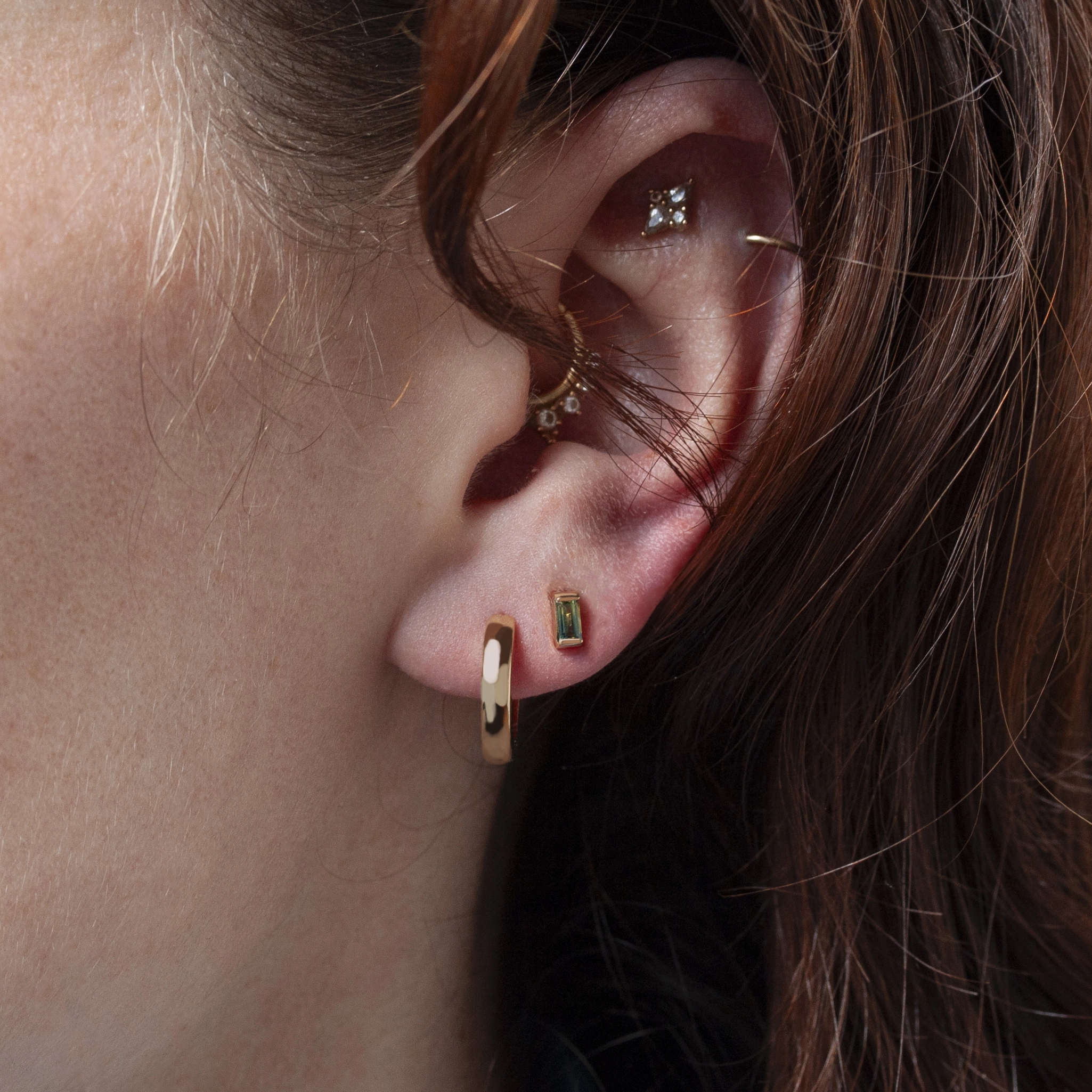 Bar-set stud earrings by Philadelphia’s Emily Chelsea Jewelry, featuring Australian baguette bicolor sapphires with a blue-to-yellow gradient.