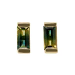 Custom bicolor sapphire stud earrings from Philadelphia's Emily Chelsea Jewelry, featuring a blue-to-yellow gradient in a bar setting. Made to order.