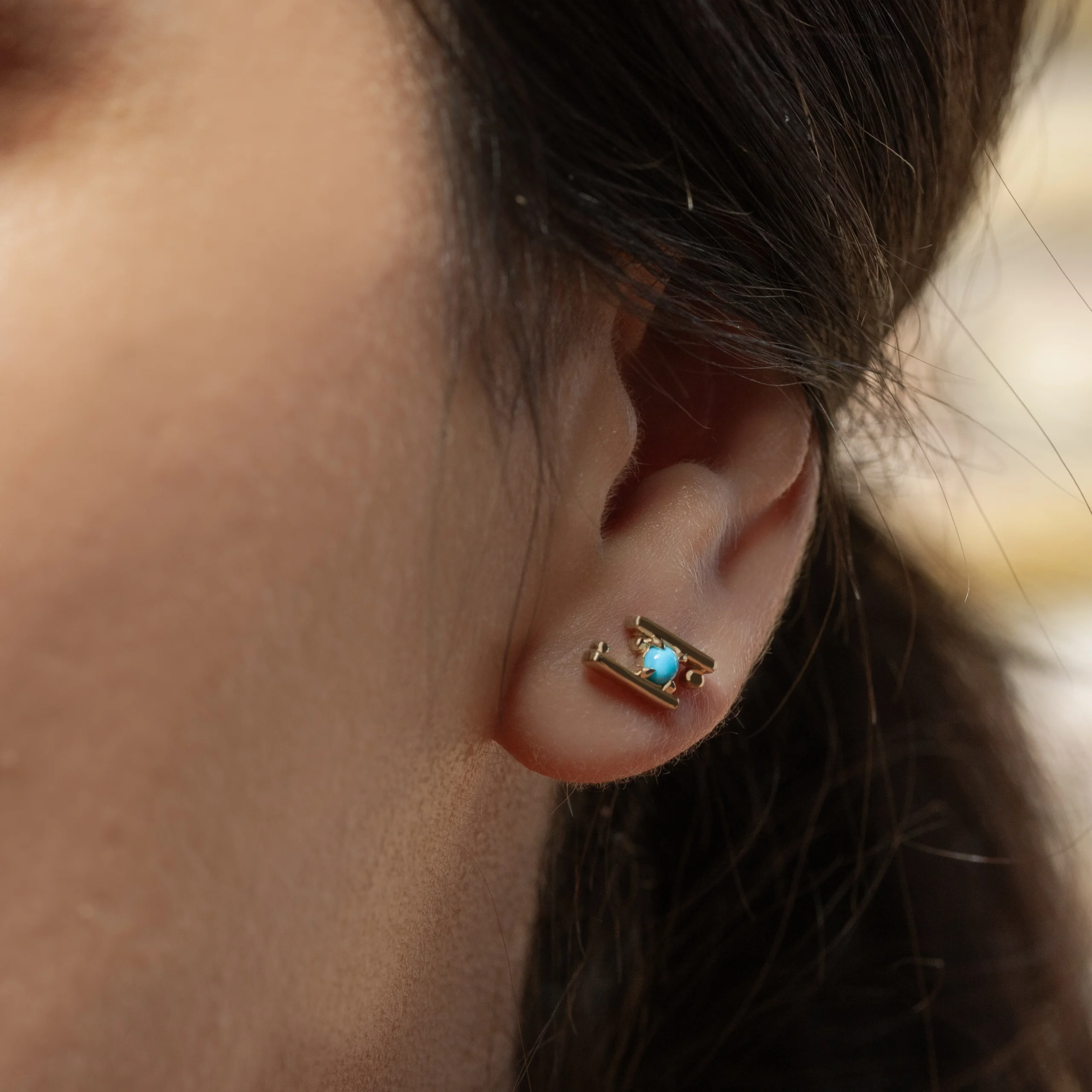 Hand in Hand Stud Earrings by Philadelphia’s Emily Chelsea Jewelry, featuring Arizonian turquoise cabochons set between sleek metal bars.
