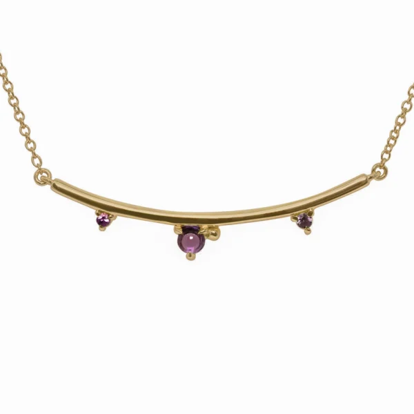 Arc Necklace by Philadelphia’s Emily Chelsea Jewelry, featuring Uruguayan amethyst, Tanzanian lavender spinel, and a delicate curved design.