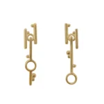 Break Through Dangle Earrings by Philadelphia’s Emily Chelsea Jewelry, featuring a cross-metal design symbolizing resilience and forward movement.