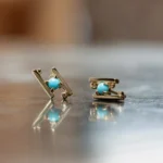 Hand in Hand Stud Earrings by Philadelphia’s Emily Chelsea Jewelry, featuring Arizonian turquoise cabochons set between sleek metal bars.