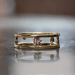 Pinnacle Hoops by Emily Chelsea Jewelry, custom hoops with Uruguayan amethyst, Tanzanian lavender spinel, and sleek metal accents.