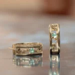 Pinnacle Hoops by Emily Chelsea Jewelry, custom hoops with Indian moss agate, Nigerian green tourmaline, and sleek metal accents.