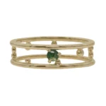 Pinnacle Band by Emily Chelsea Jewelry, a custom-designed ring featuring a 3mm Indian moss agate cabochon, symbolizing milestones and movement forward.