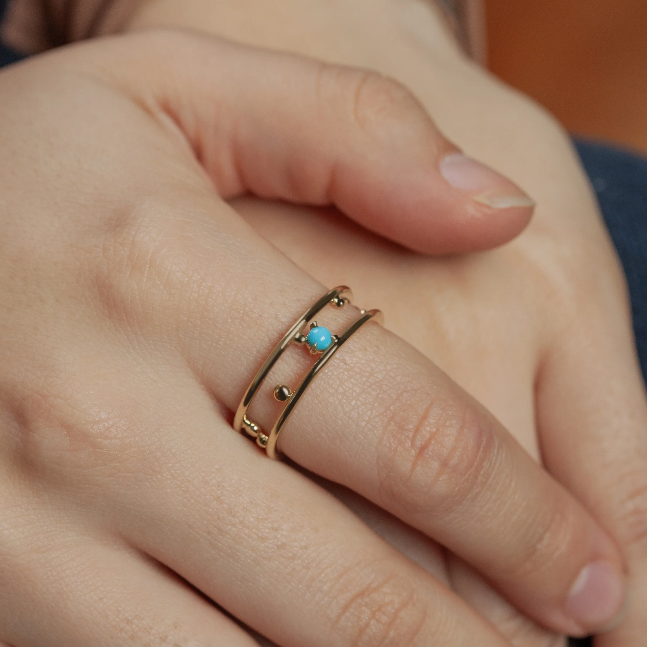 Pinnacle Band by Emily Chelsea Jewelry, a custom-designed ring with a 3mm Arizonian turquoise cabochon, symbolizing milestones and forward movement.