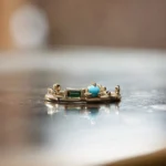 The Renewal Band by Emily Chelsea Jewelry, featuring 3mm Arizonian turquoise cabochon and 4x2mm Nigerian teal tourmaline baguette, symbolizing milestones and progress.