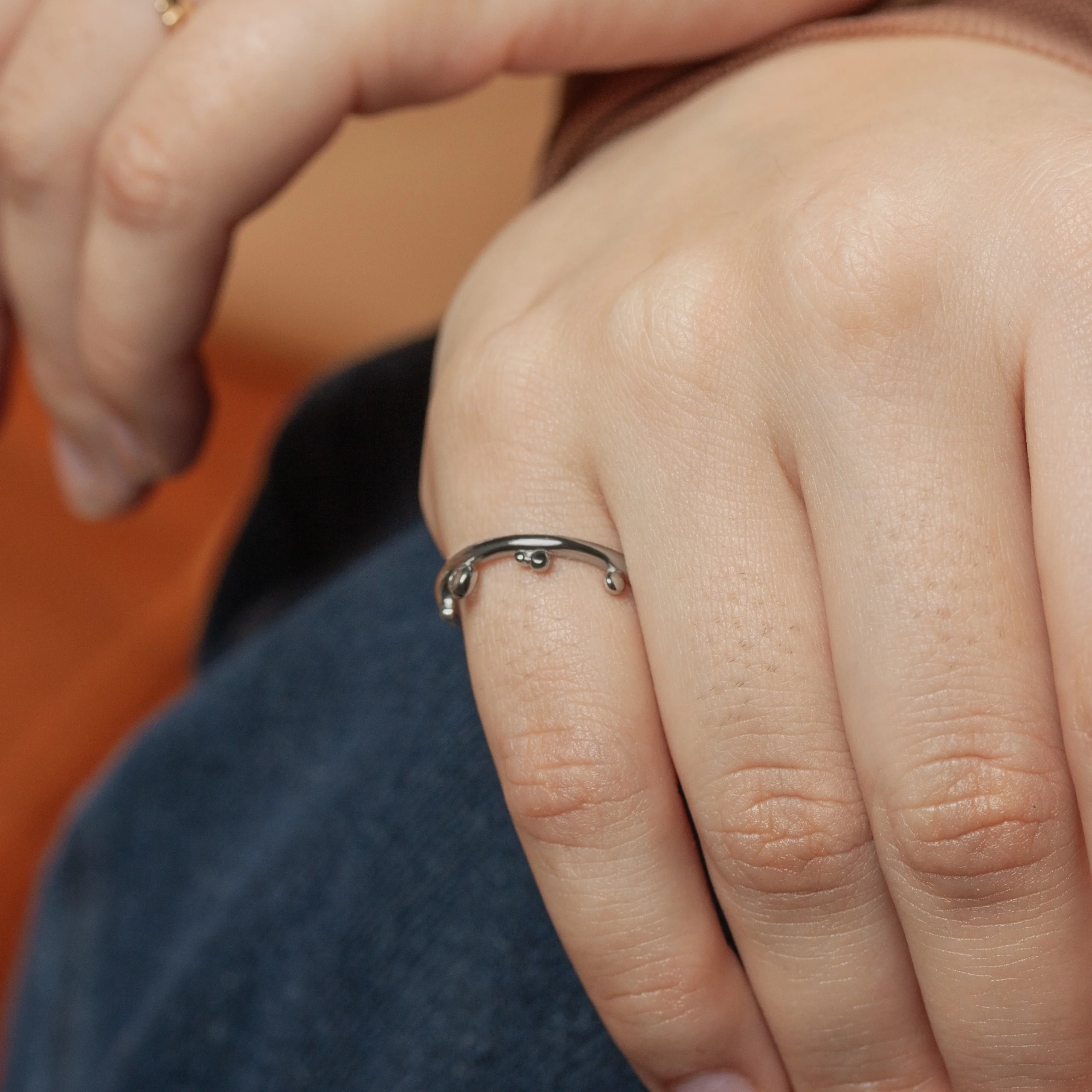 The Renewal Band, custom-designed by Philadelphia jeweler Emily Chelsea Jewelry, features a minimalist design symbolizing milestones and moving forward.