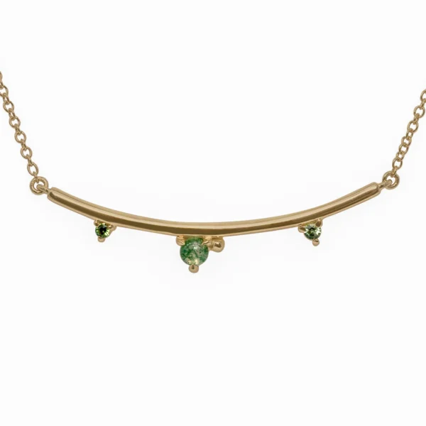 Arc Necklace by Philadelphia’s Emily Chelsea Jewelry, featuring Indian moss agate, Nigerian green tourmaline, and a gracefully curved design.
