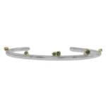 Silver Lining Cuff by Philadelphia’s Emily Chelsea Jewelry, featuring Indian moss agate, Nigerian green tourmaline, and a polished finish symbolizing optimism.