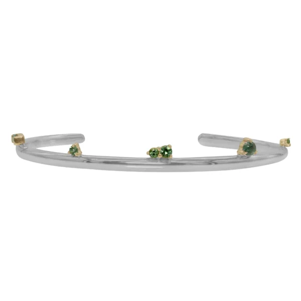 Silver Lining Cuff by Philadelphia’s Emily Chelsea Jewelry, featuring Indian moss agate, Nigerian green tourmaline, and a polished finish symbolizing optimism.